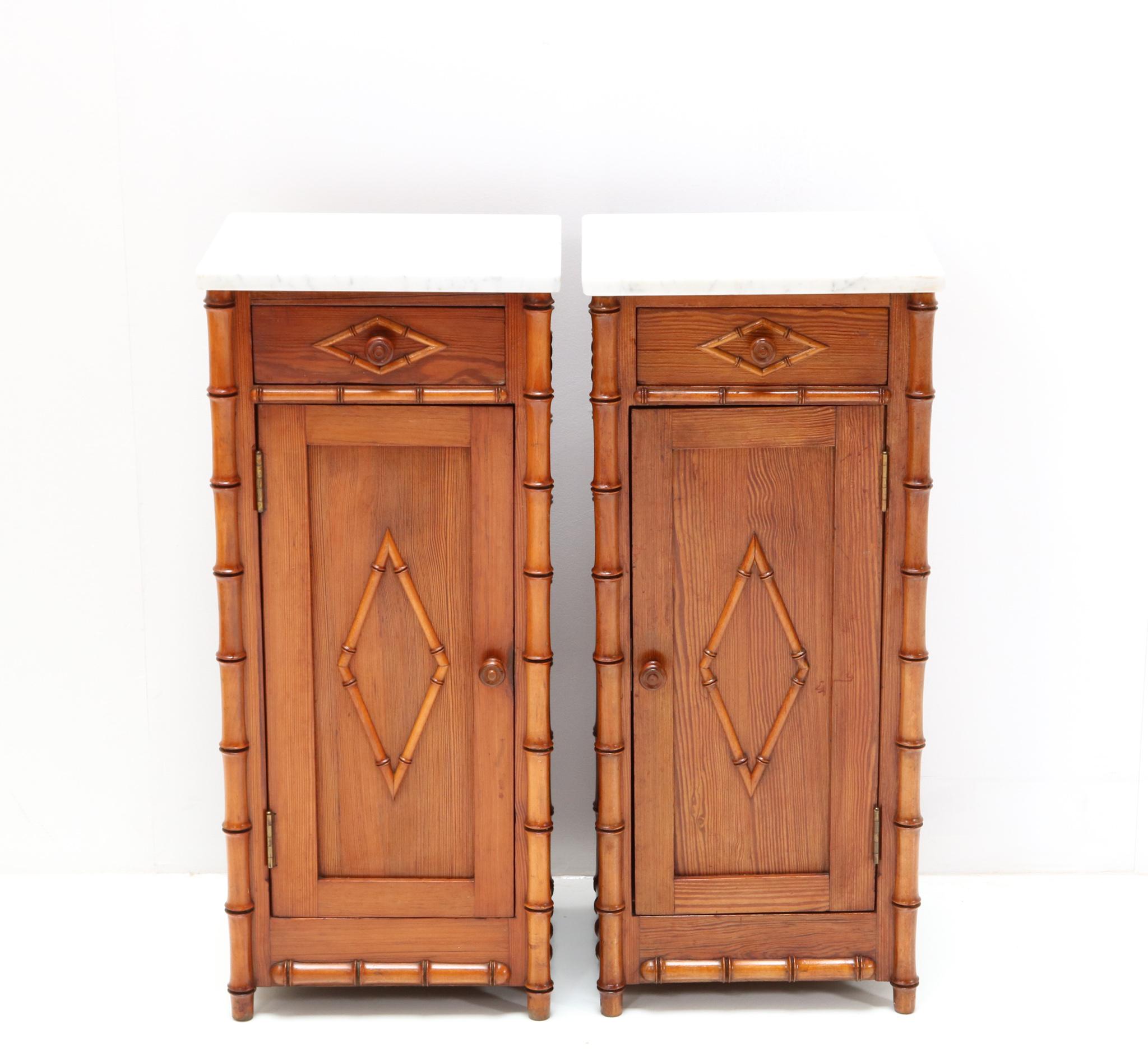 Magnificent and rare pair of Art Nouveau nightstands or bedside tables.
Striking French design from the 1900s.
Solid pine faux bamboo with original white marble tops.
This wonderful Art Nouveau set of nightstands or bedside tables is in very good