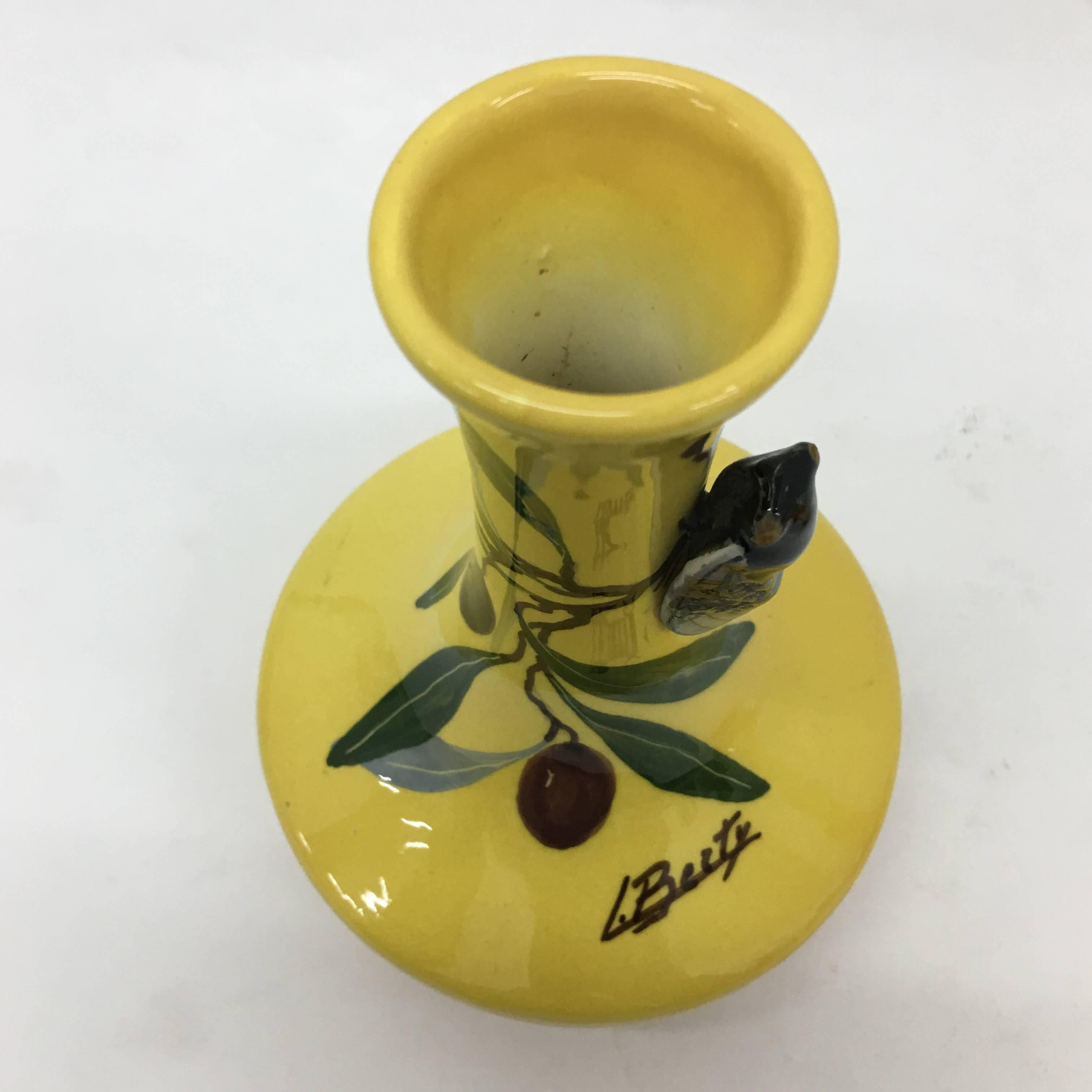 Nice set of yellow ceramic small vases signed Berty, both have a raised cicada.