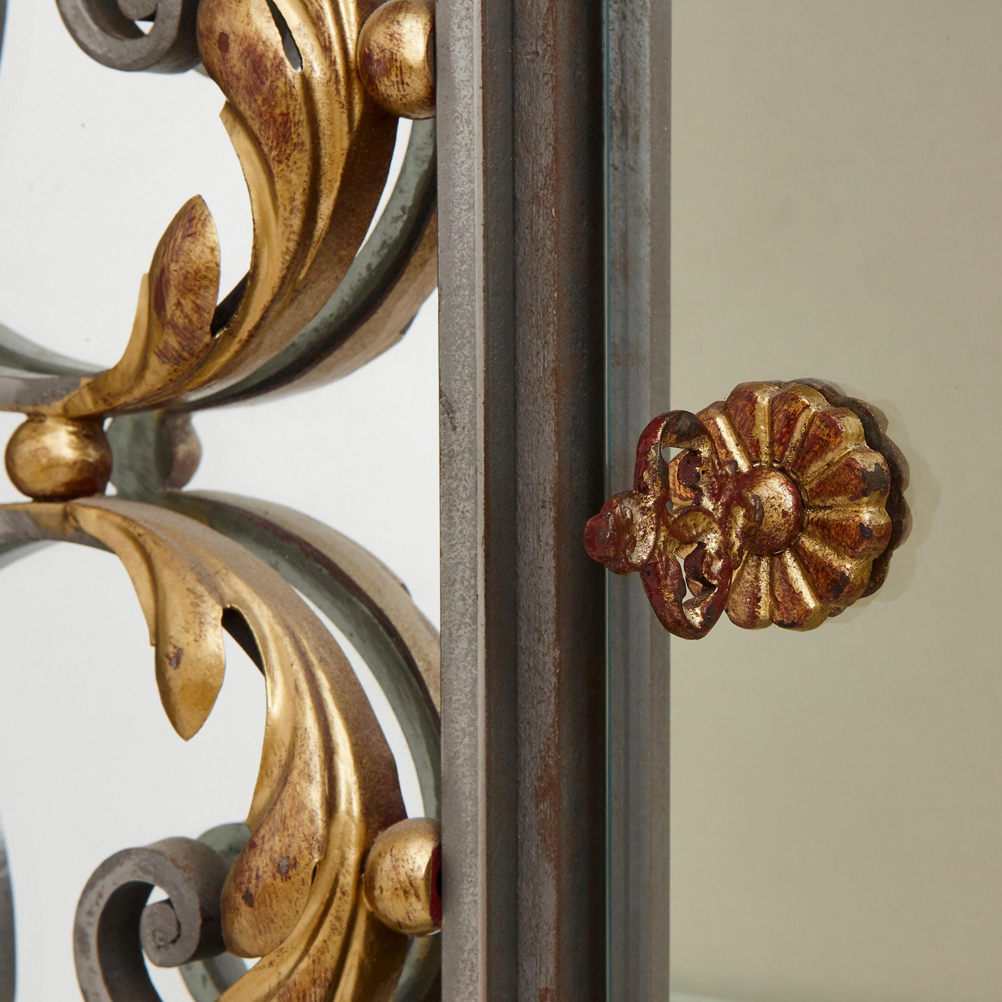 These wonderful vitrines (display cabinets) were created in France in the early 20th century. They are designed in an elegant Art Nouveau style which was in vogue in this period. 

The vitrines feature wide rectangular steel bodies, which are