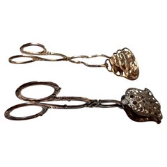 Dos pinzas de plata Art Nouveau para servir pasteles, Alemania, 1900