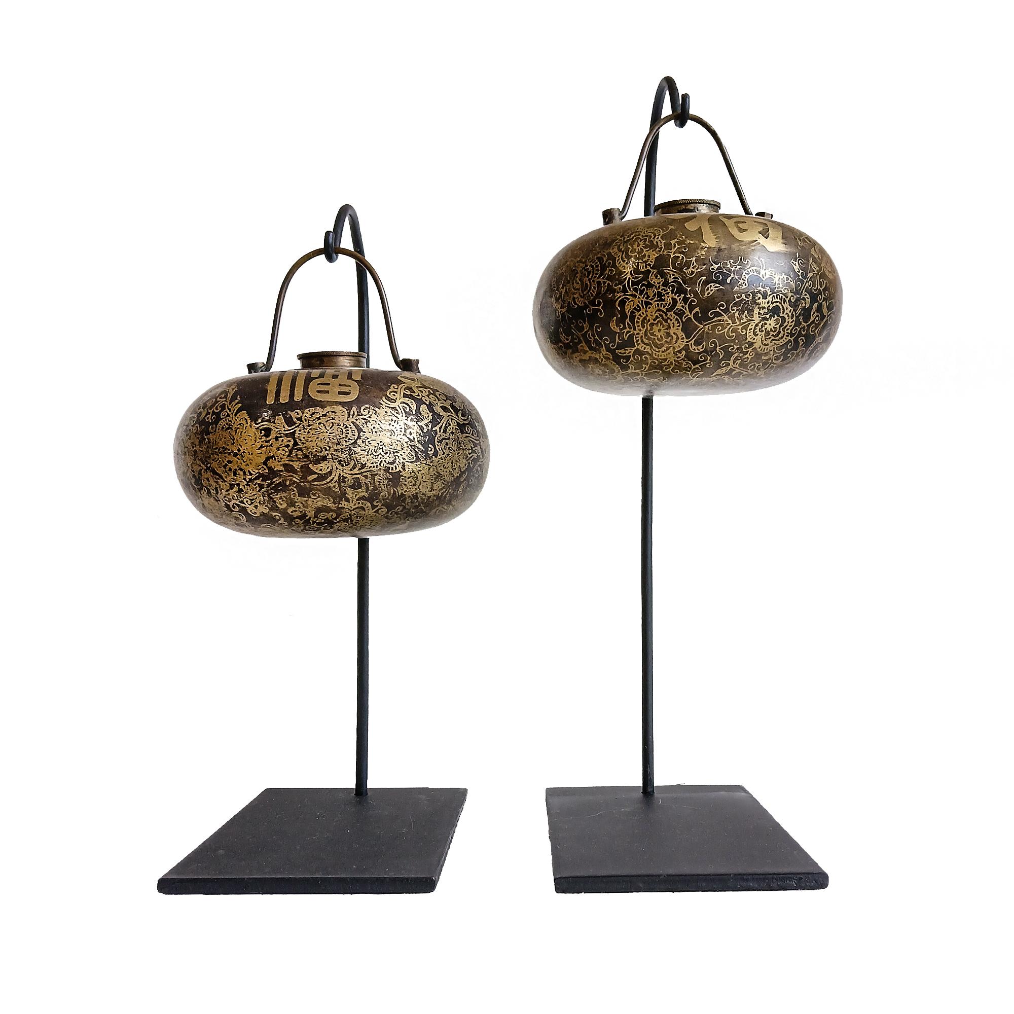 Two brass water containers, used as bed warmer pots. China, early 20th Century. 

Both are Intricately decorated with gilt line in floral motif, plus inscriptions of 