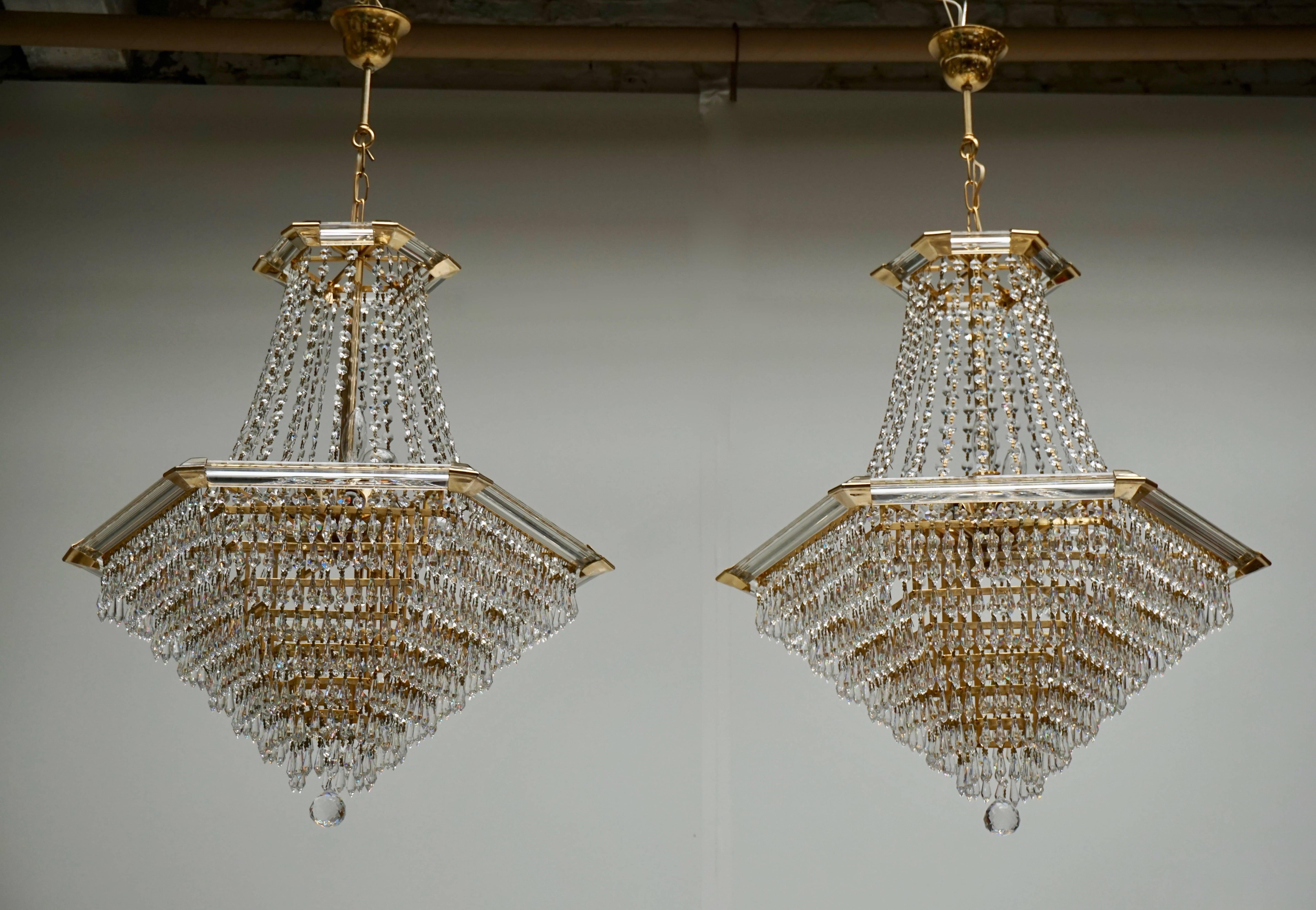 Two very exclusive and high quality chandeliers by Bakalowits & Söhne, Austria, manufactured in midcentury, circa 1960. They are made of a gold-plated brass frame decorated with hundreds of faceted glass crystals.
Measures: Diameter 65 cm.
Height