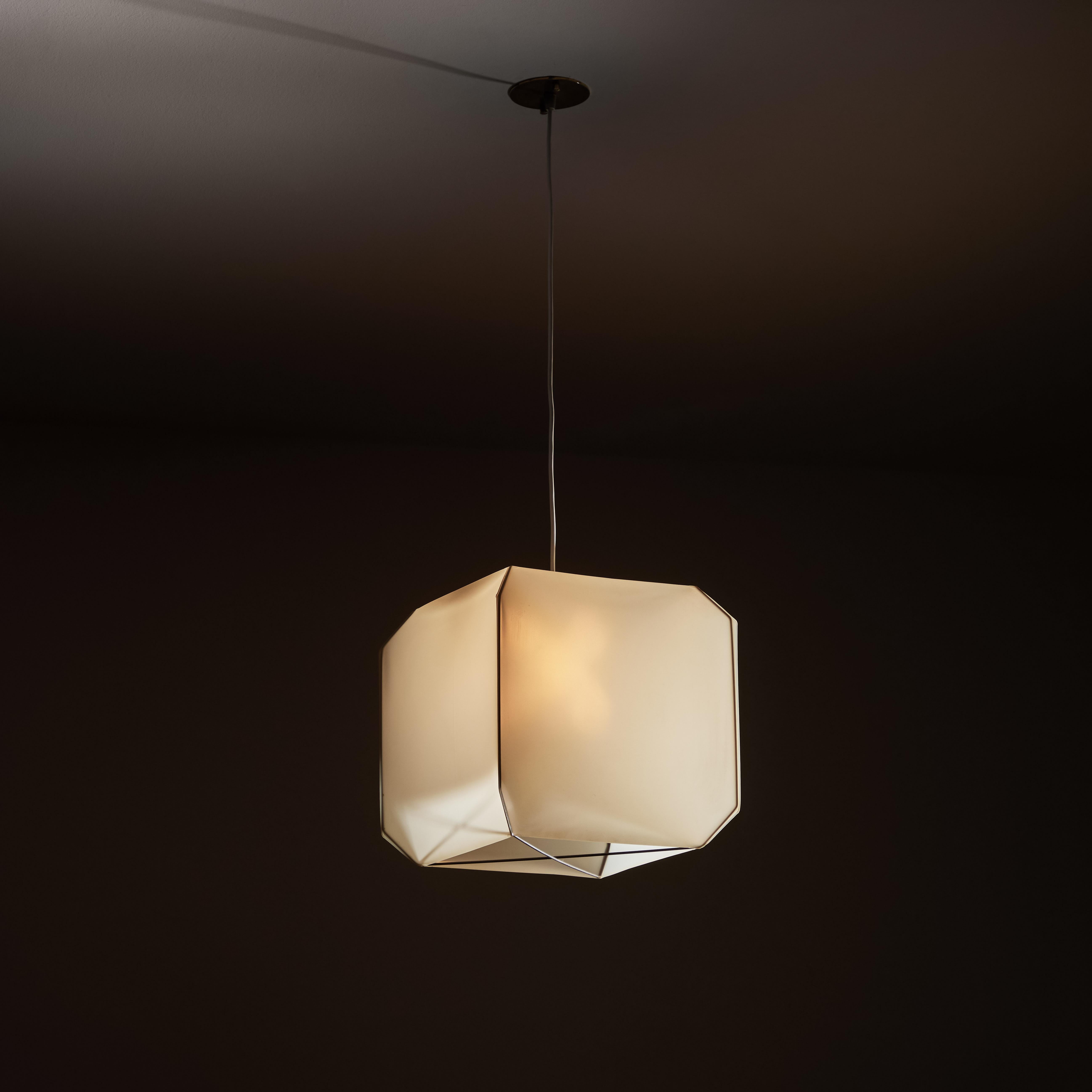 Bali suspension light by Bruno Munari for Danese Milano. Designed in Italy, 1958. Brass, metal, silk and acrylic. Wired for US standards. Custom brass ceiling plate. We recommend one Edison 40w maximum bulb per light. Bulbs provided as a one time