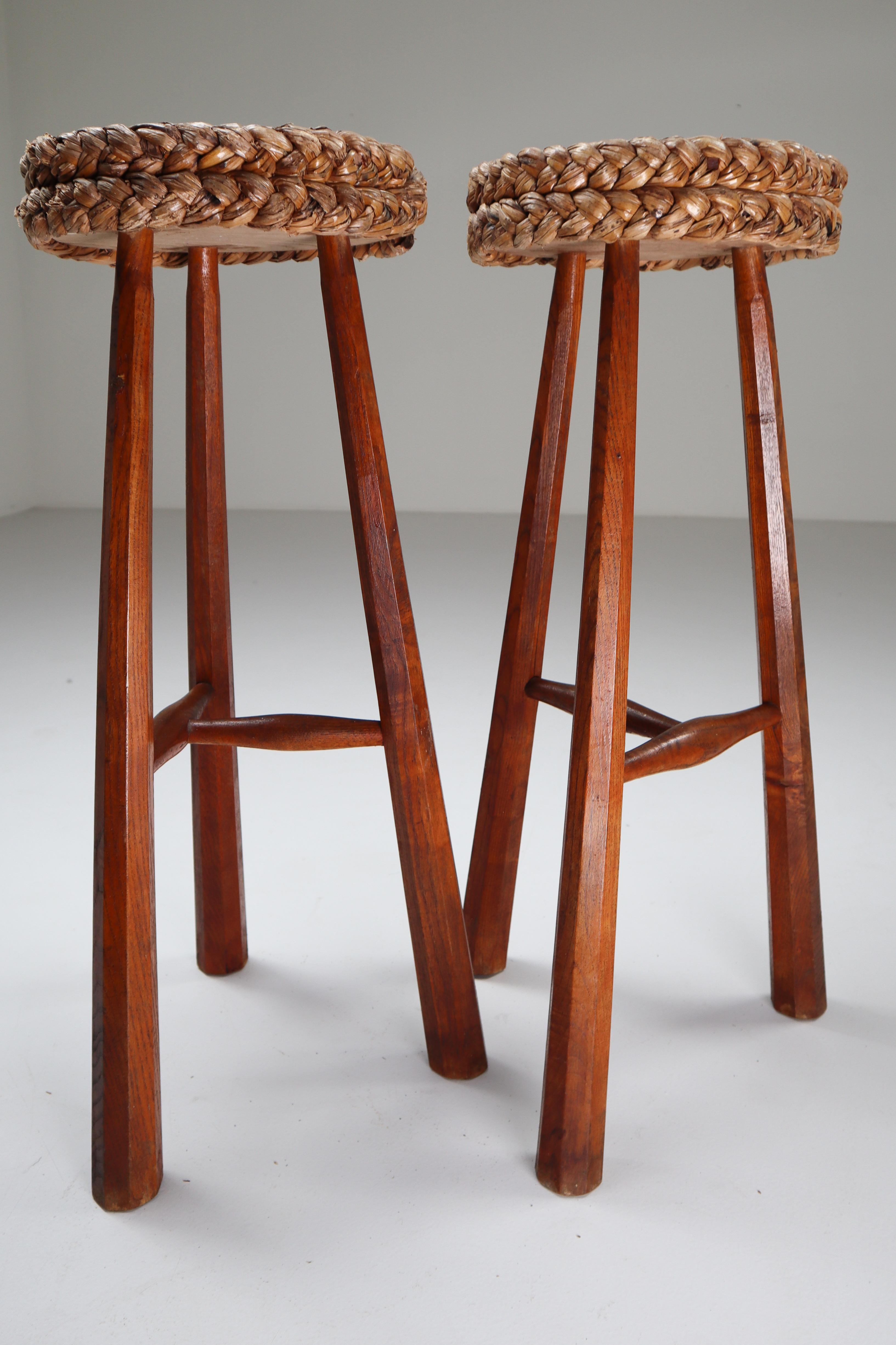 Pair of two Adrien Audoux and Frida Minet bar stools made of stained beech and abaca rope with beautiful woven design. This natural style is typical for the French design of Audoux-Minet established in Marseille. This robust French set originates