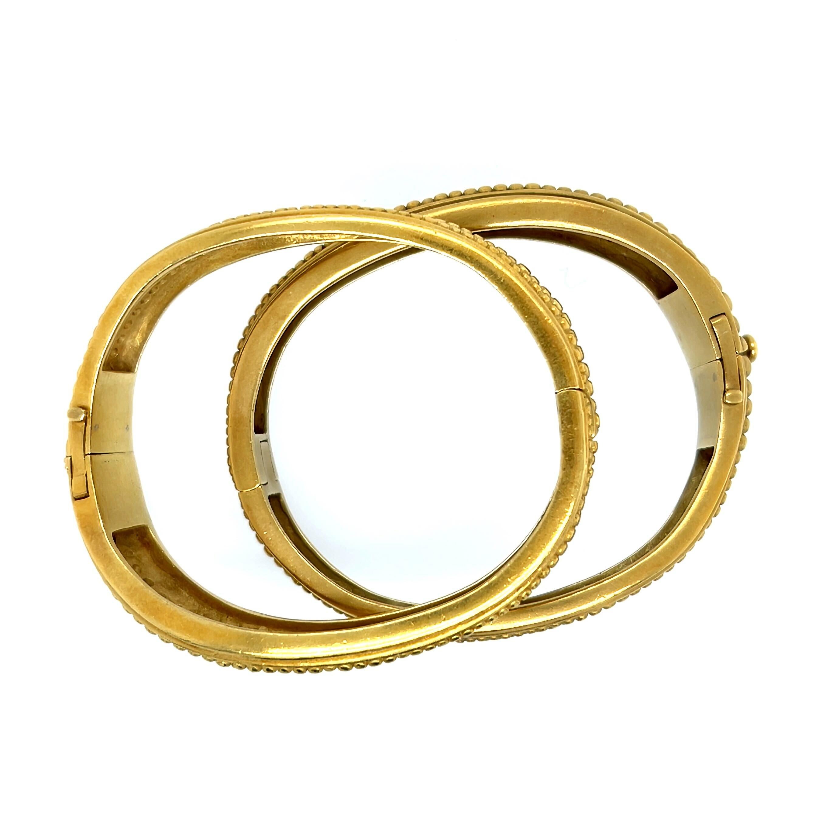 A pair of 18 karat yellow gold and diamond bracelets, Barry Kieselstein-Cord, circa 1982.  Each Caviar bracelet designed as tapering hinged wavy bangle with two rows of beadwork all around, one bracelet set across the top with approximately 56 round