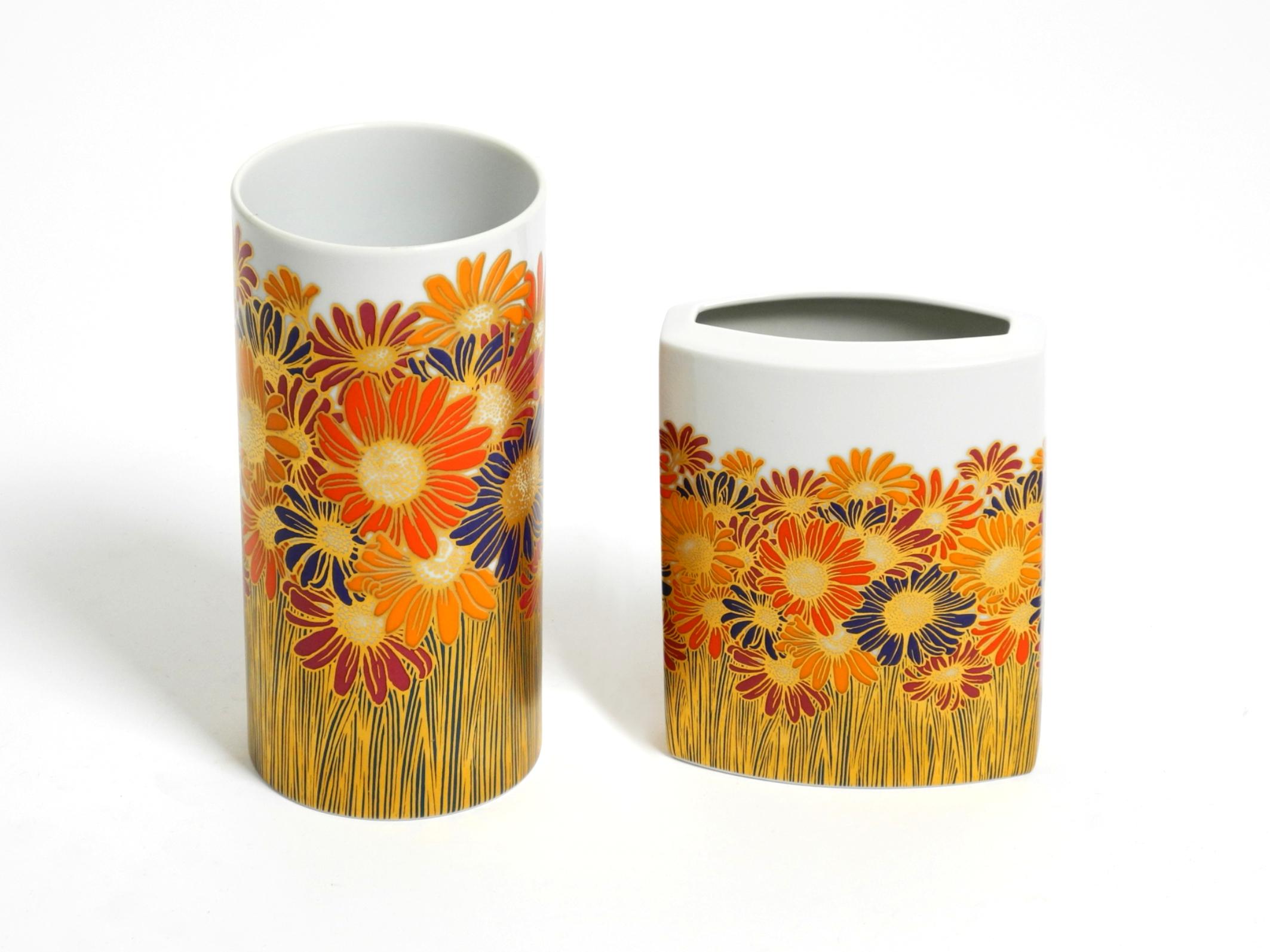 Two beautiful white porcelain vases with typical colorful floral motifs from the 1980s.
Designed by Rosamonde Nairac for Rosenthal studio-line.
Signed by the designer and manufacturer.
A fantastic, high-quality design by Rosenthal.
Both vases are in