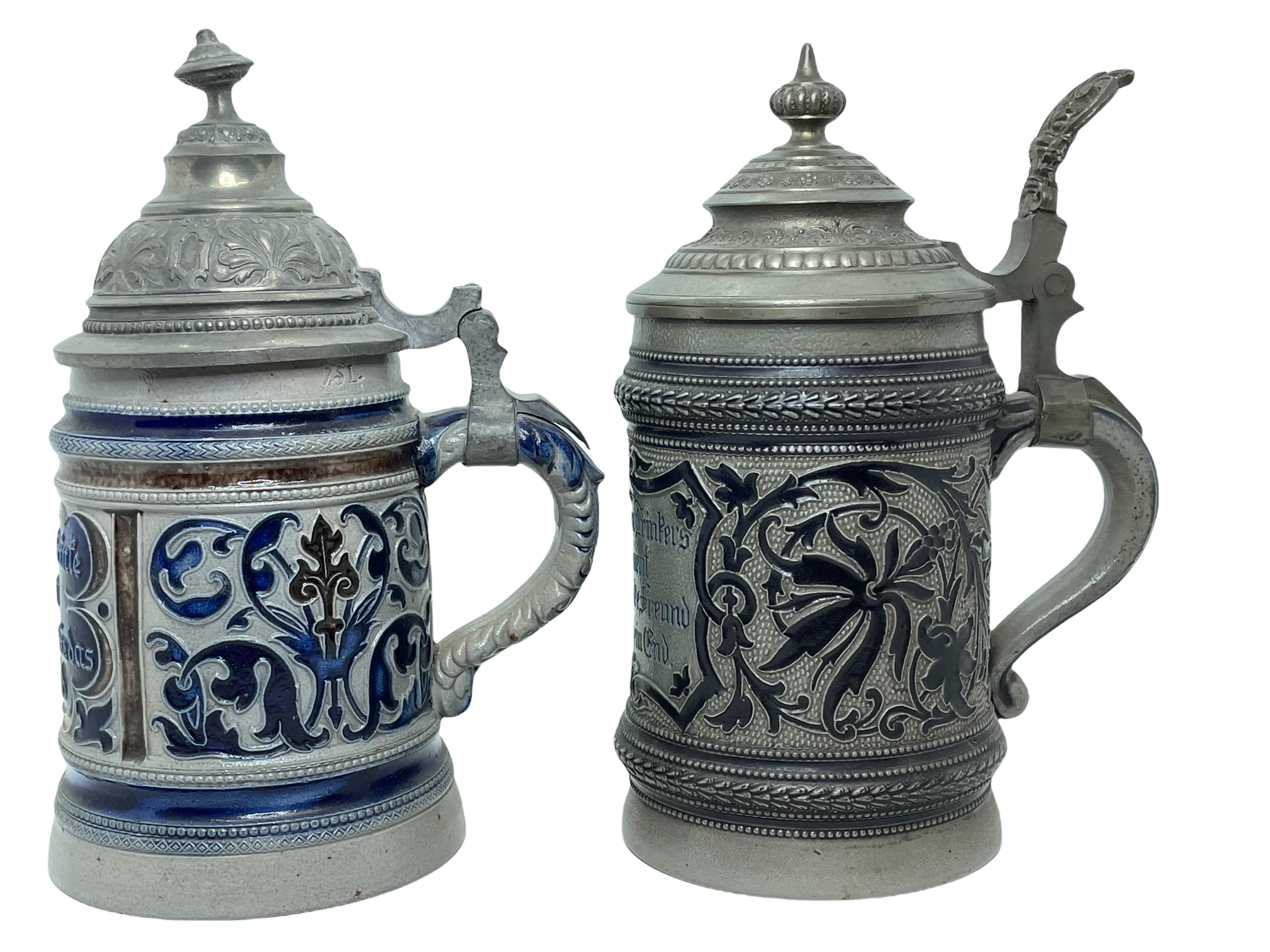 A set of two gorgeous beer stein, made in the Westerwald Area in Germany. These beer stein has been made in Germany, circa 1900s. Absolutely gorgeous pieces still in great used condition. Lid works properly, but is a little shaky. Each is a 1/2