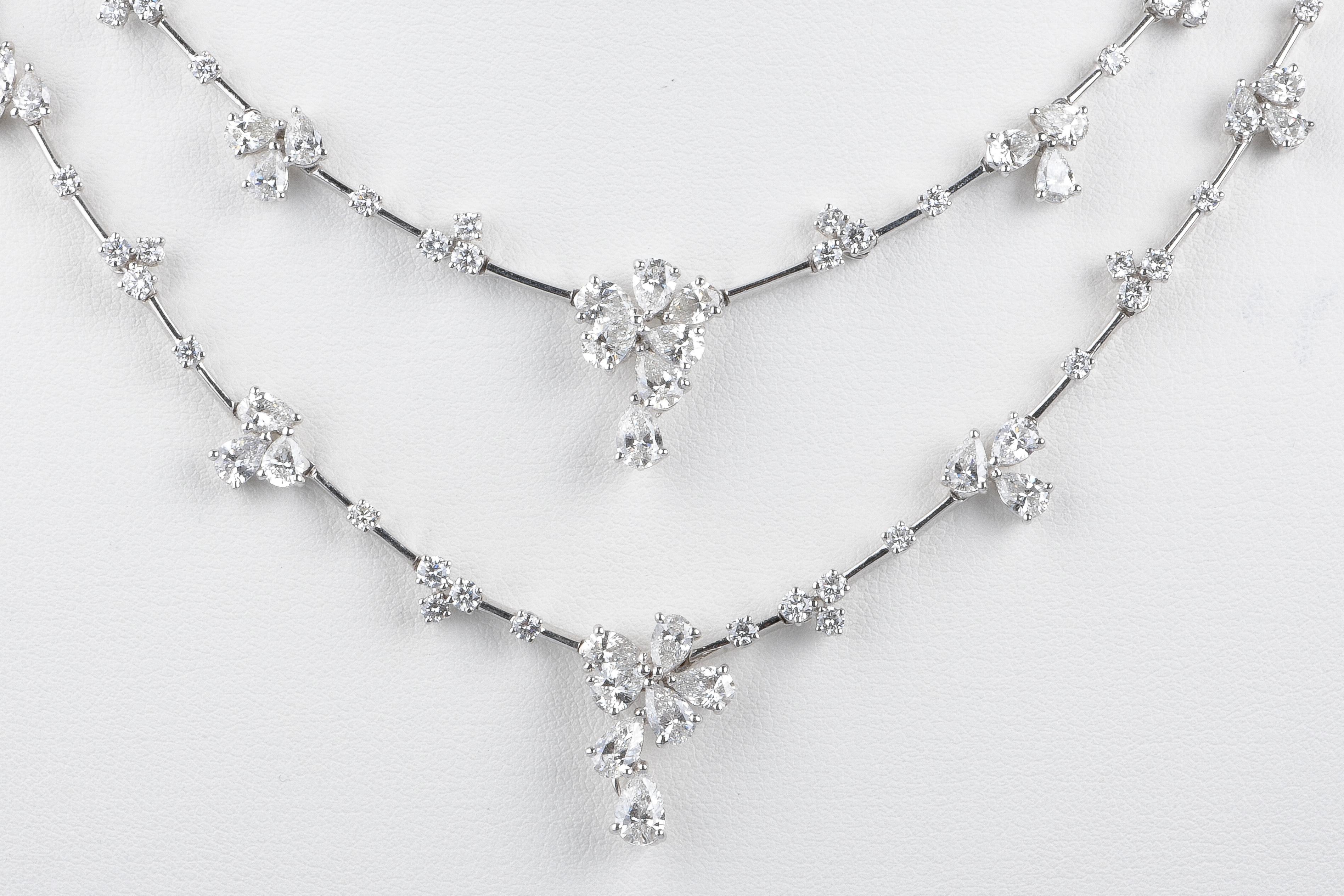 Two beautiful Haute Joaillerie 18 carat white gold necklaces designed with 138 round brillant cut diamonds weighing 4.50 carat and 70 pear-cut diamonds weighing 10.66 carat. Total diamonds carat is 15.16

Weight: 47.54 gr. 

Dimensions : 42 and 46