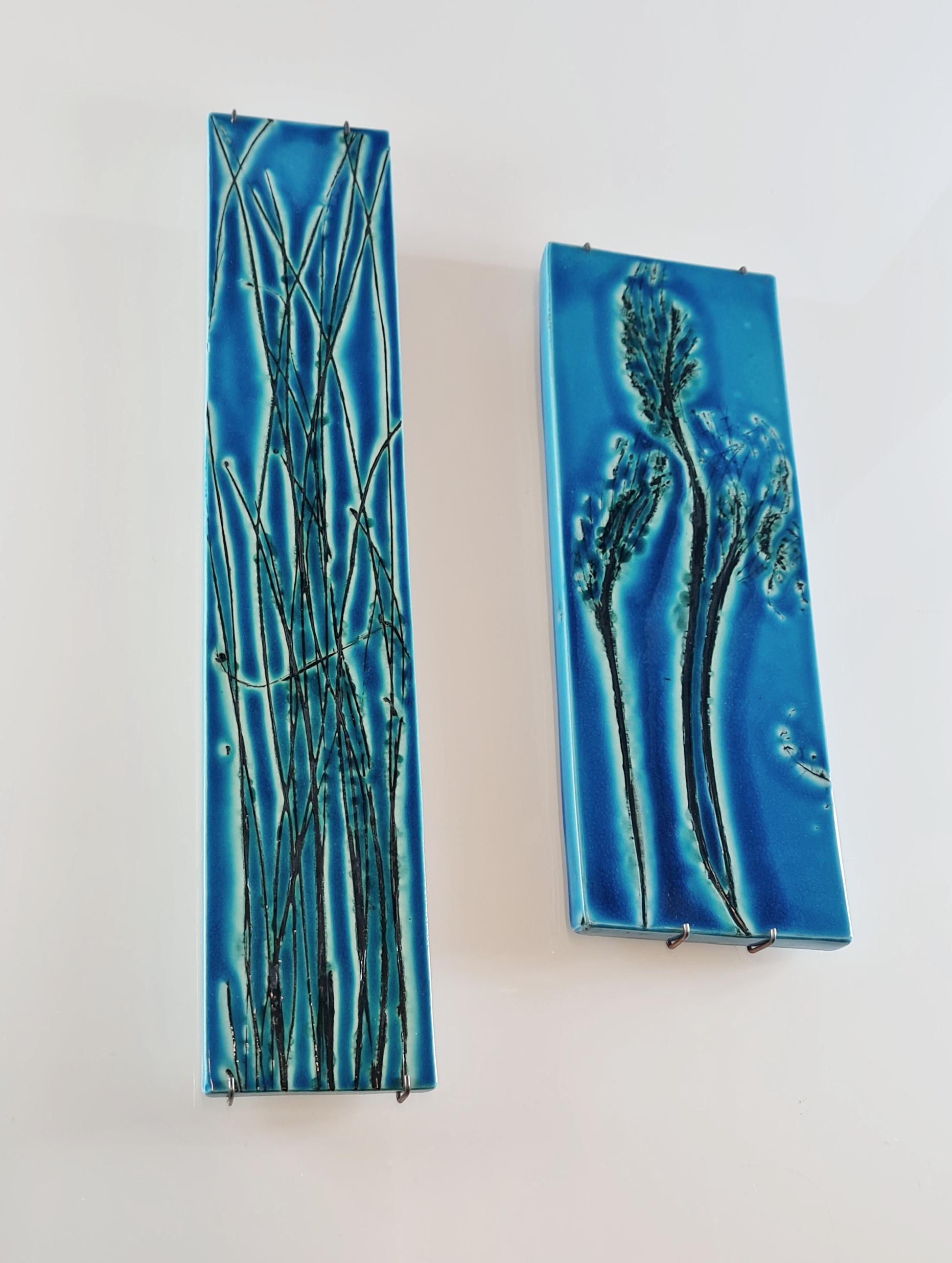 As with a lot Finnish design items the motif for both of these reliefs is taken from nature, but with the designers own approach of course. Designed by Toini Muona the leading name in the ceramic scene of her time, these exceptionally beautiful