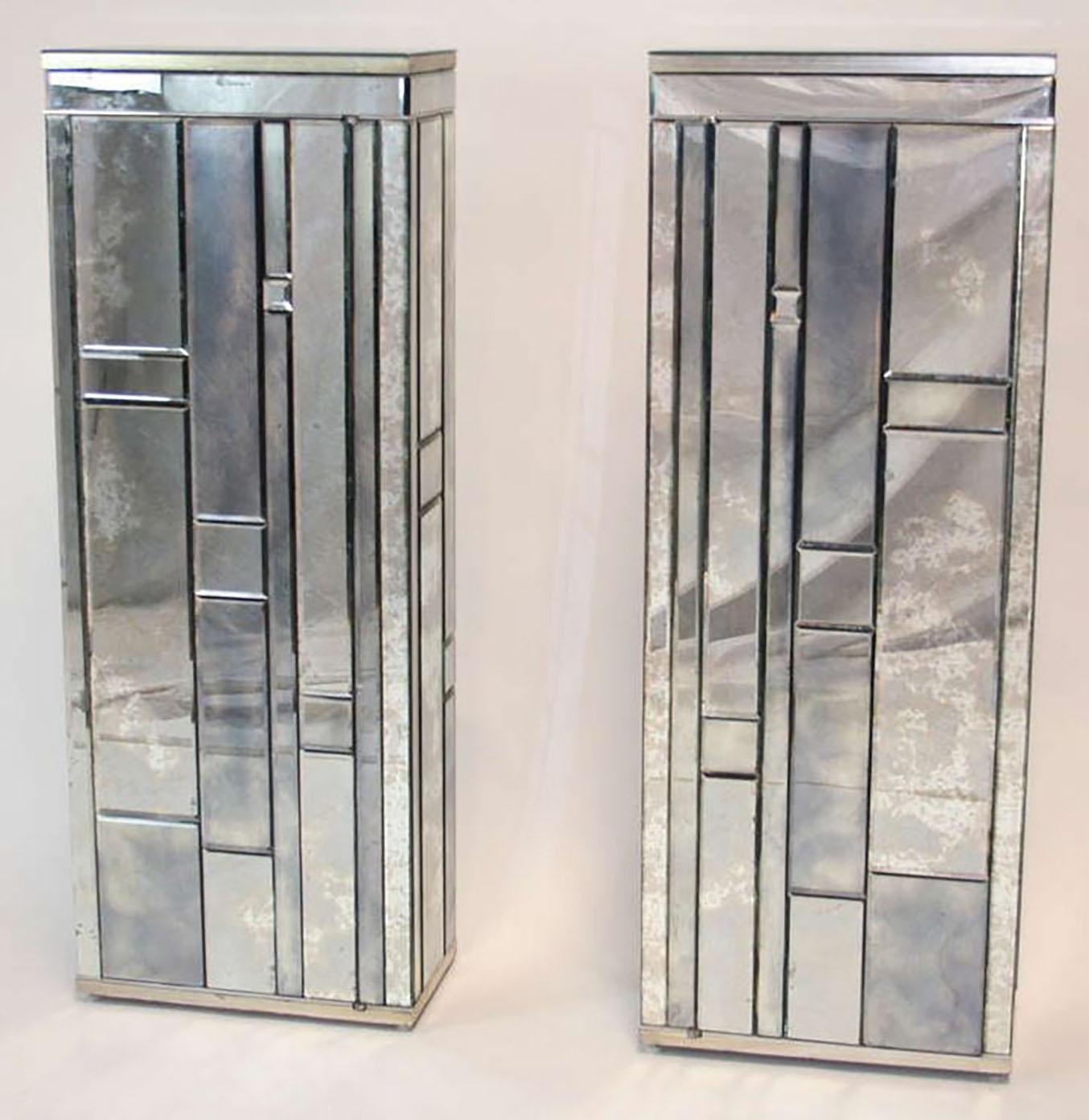 Exceptional pair of mirrored single door cabinets. Beveled, antiqued mirror covers piece, with silver leaf wood trim. By William Lyons Design Craft of NYC, 1975