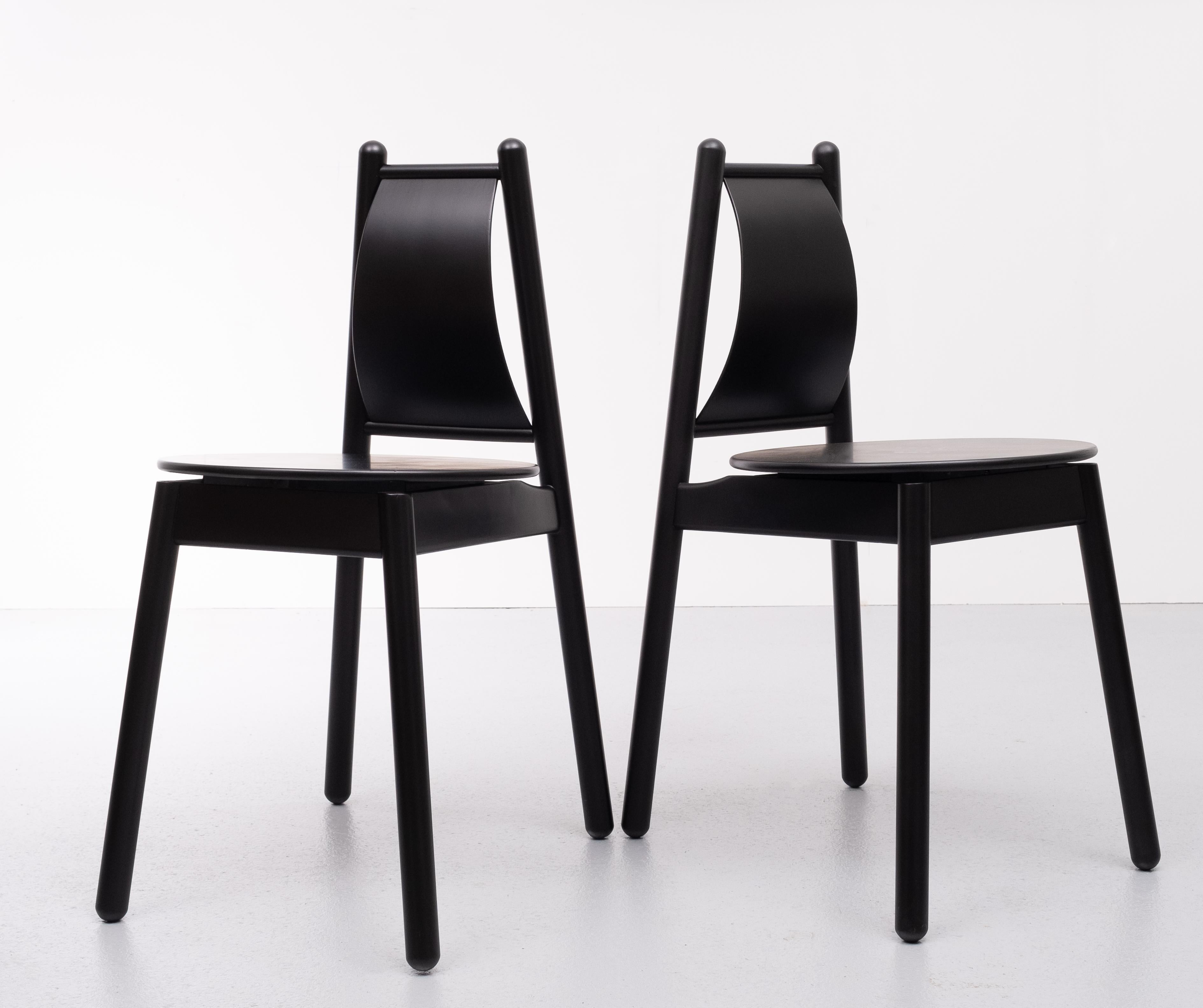 Unique design these small black side chairs. Great looking chairs. Underneath the chair there is 
a sticker. S aying Design Vico Magistretti purchased 1993 by a well now furniture design dealer.