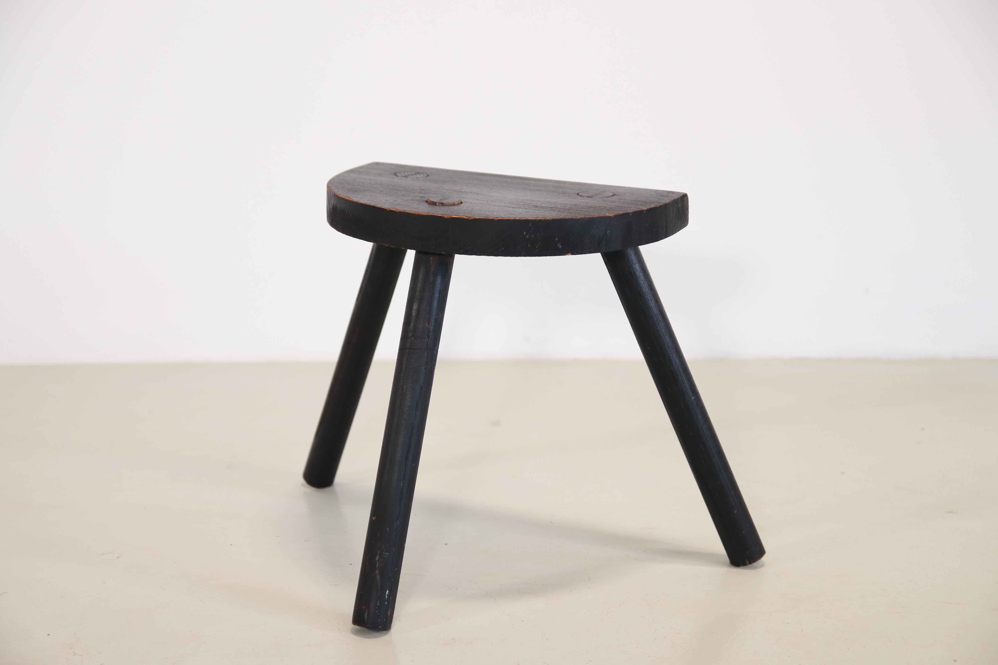 Two old milking stools from France. The stools can be used as side tables or bedside tables and add a lot of atmosphere to a modern interior. A beautiful detail of craftsmanship is the way the legs are attached to the top. The stools are 34.5 cm