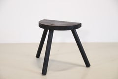 Two black French Brutalist tripod stool Rustic milking stools, 1940's
