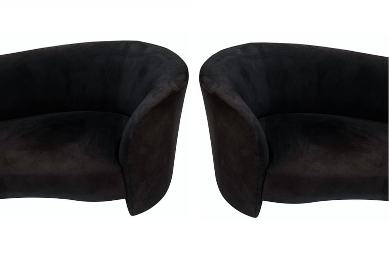 Elegant Weiman/Preview chaise lounge sofas. Each modern sculpted one arm sofa features a flowing freeform backrest with unique cutaway style design. Professionally re-upholstered in a black micro-suede. These are super comfortable and stylish