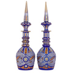 Two Bohemian Enamelled Blue Overlay Cut-Glass Decanters