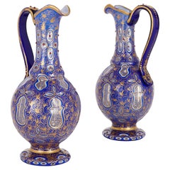 Vintage Two Bohemian Persian Style Jeweled and Gilt Blue Glass Jugs