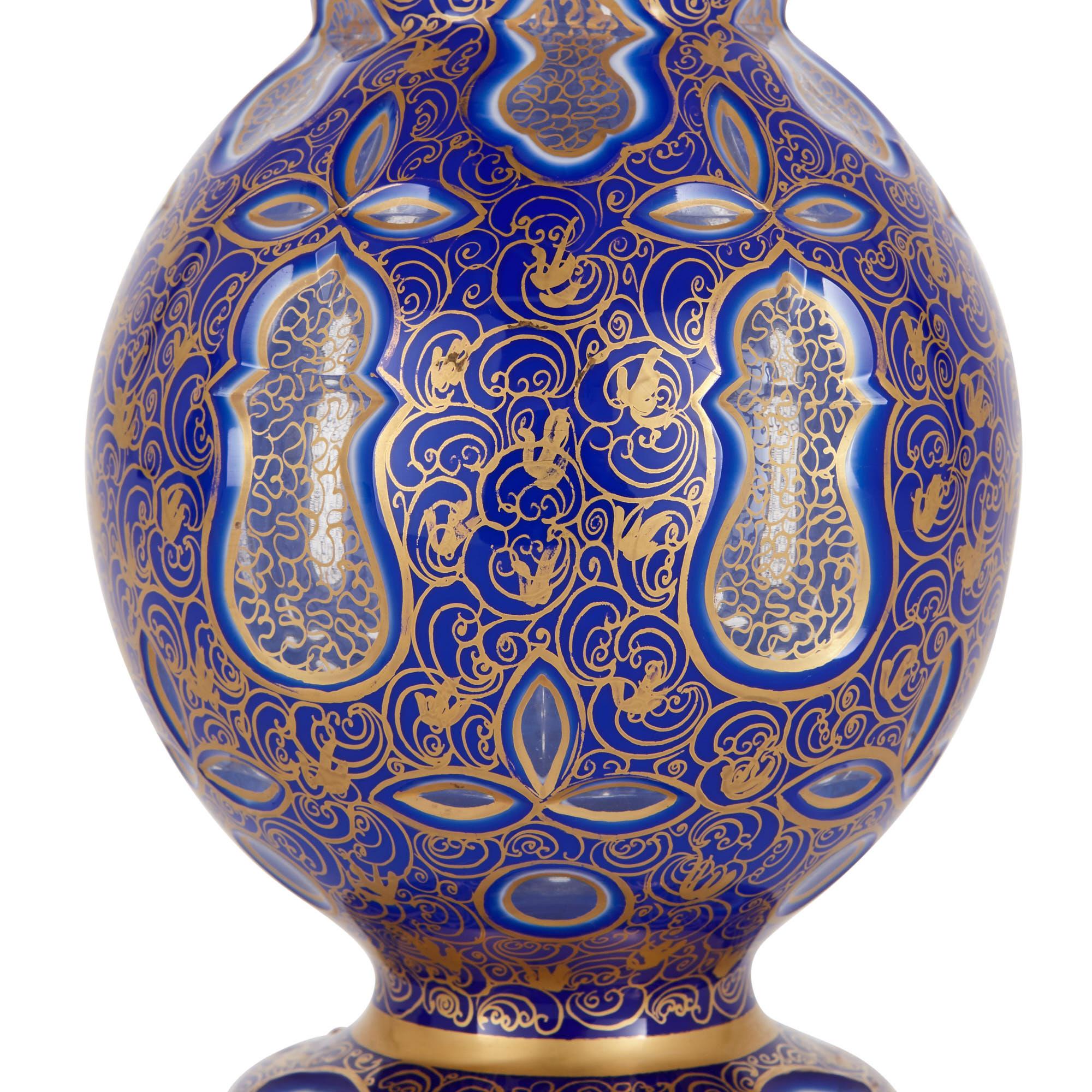 Islamic Two Bohemian Persian Style Jeweled and Gilt Blue Glass Jugs