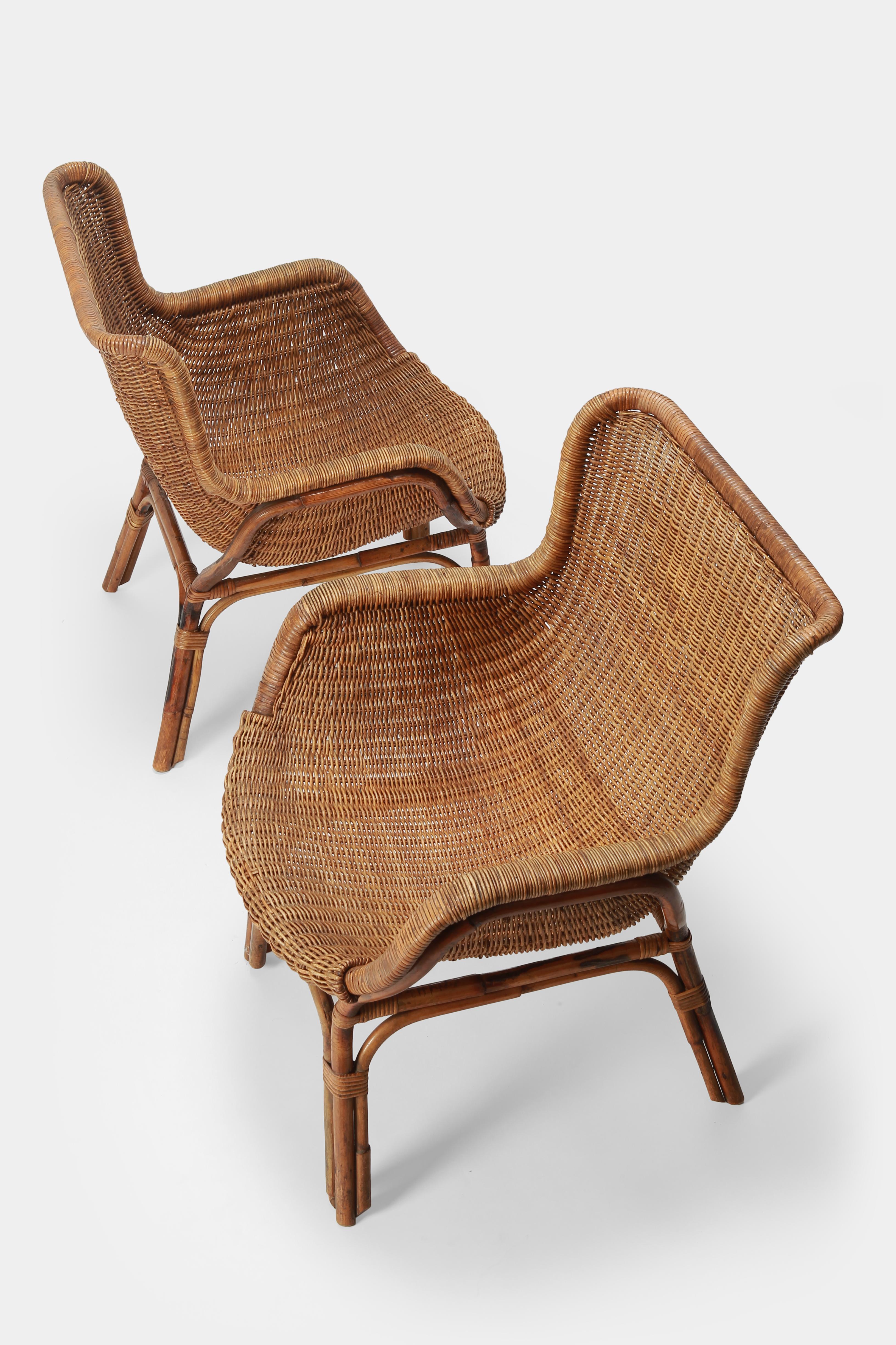 Two bamboo armchairs made by Bonacino in Italy in the 1950s. Very beautiful shape and first class craftsmanship. Gently restored and in good condition.