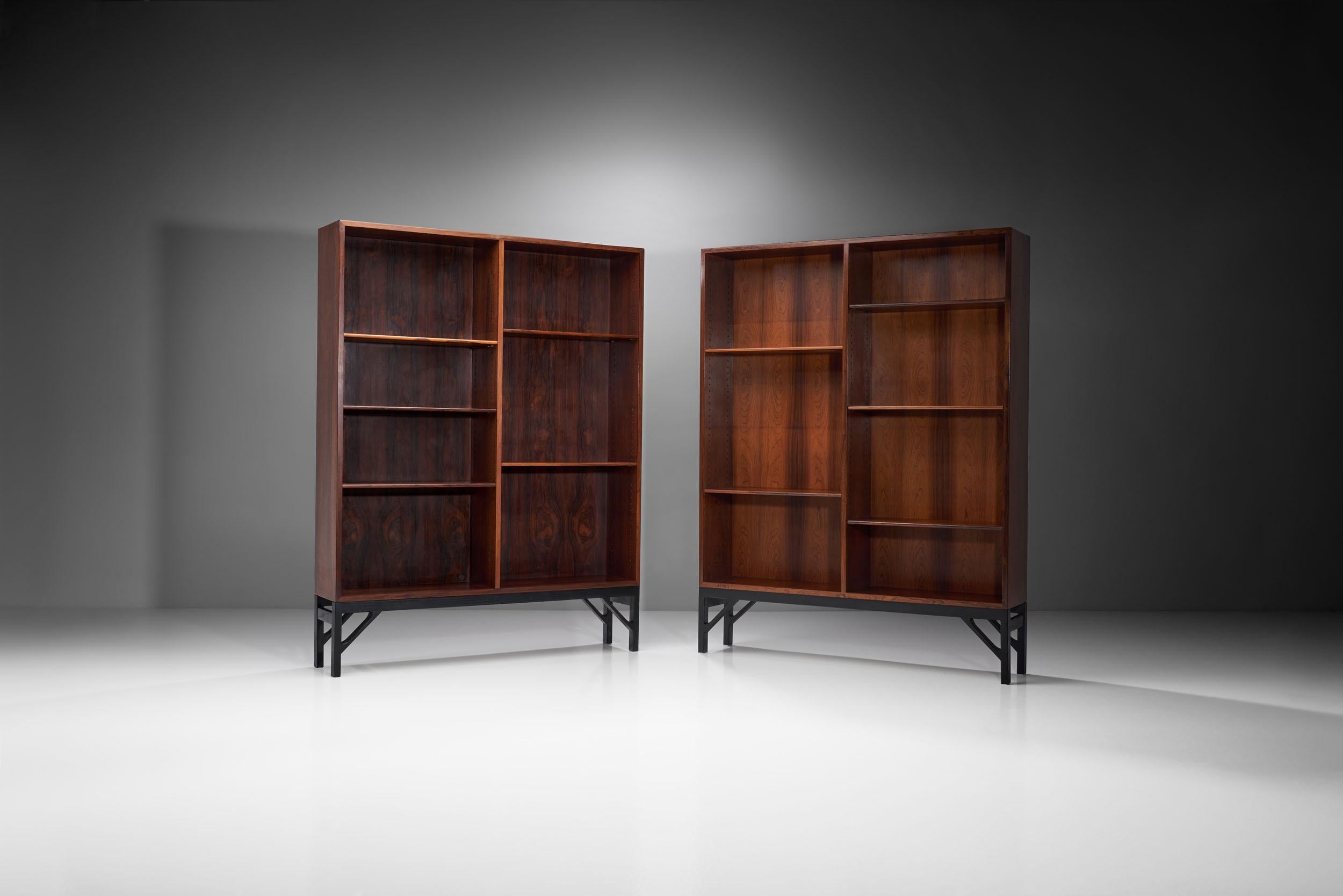 These impressive bookcases designed by Børge Mogensen reflect the Danish designer’s aesthetic that was clean and highly functional, creating pieces that stand out despite their restrained design.

The pair is made of solid wood with a beautiful