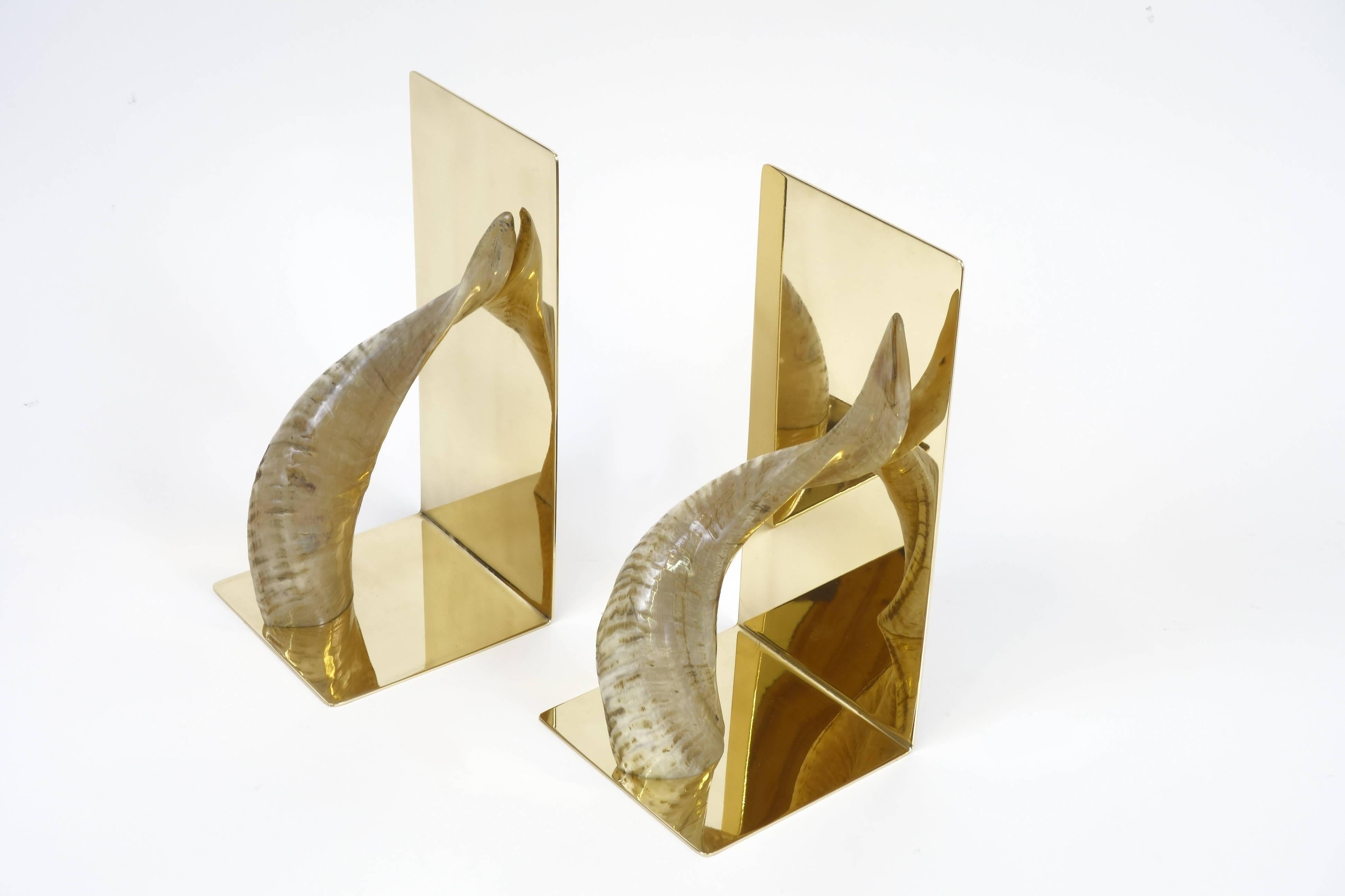 A pair of large solid brass bookends created and manufactured by the Austrian architect and designer Carl Auböck. These outstanding objects made of solid polished and decorated brass will provide understated luxury on each bookshelf. Curves as well
