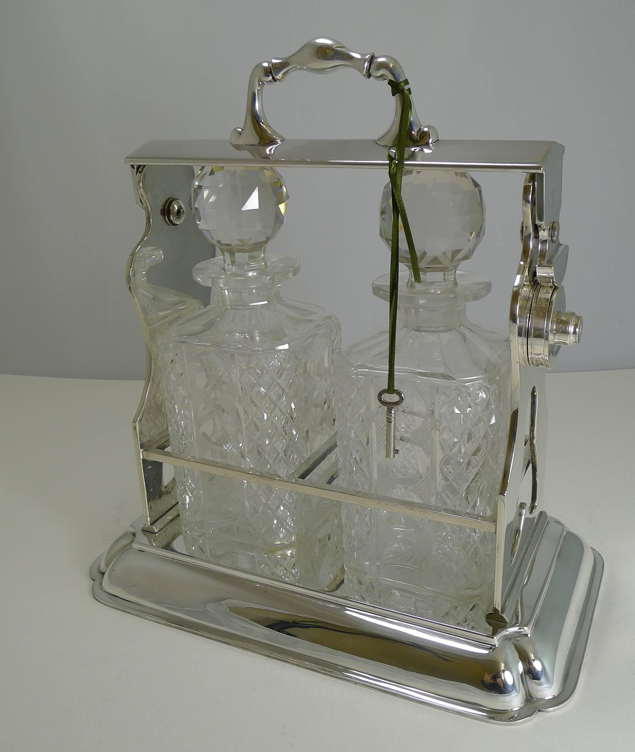 English Two Bottle Tantalus or Lockable Liquor Frame by John Grinsell & Sons