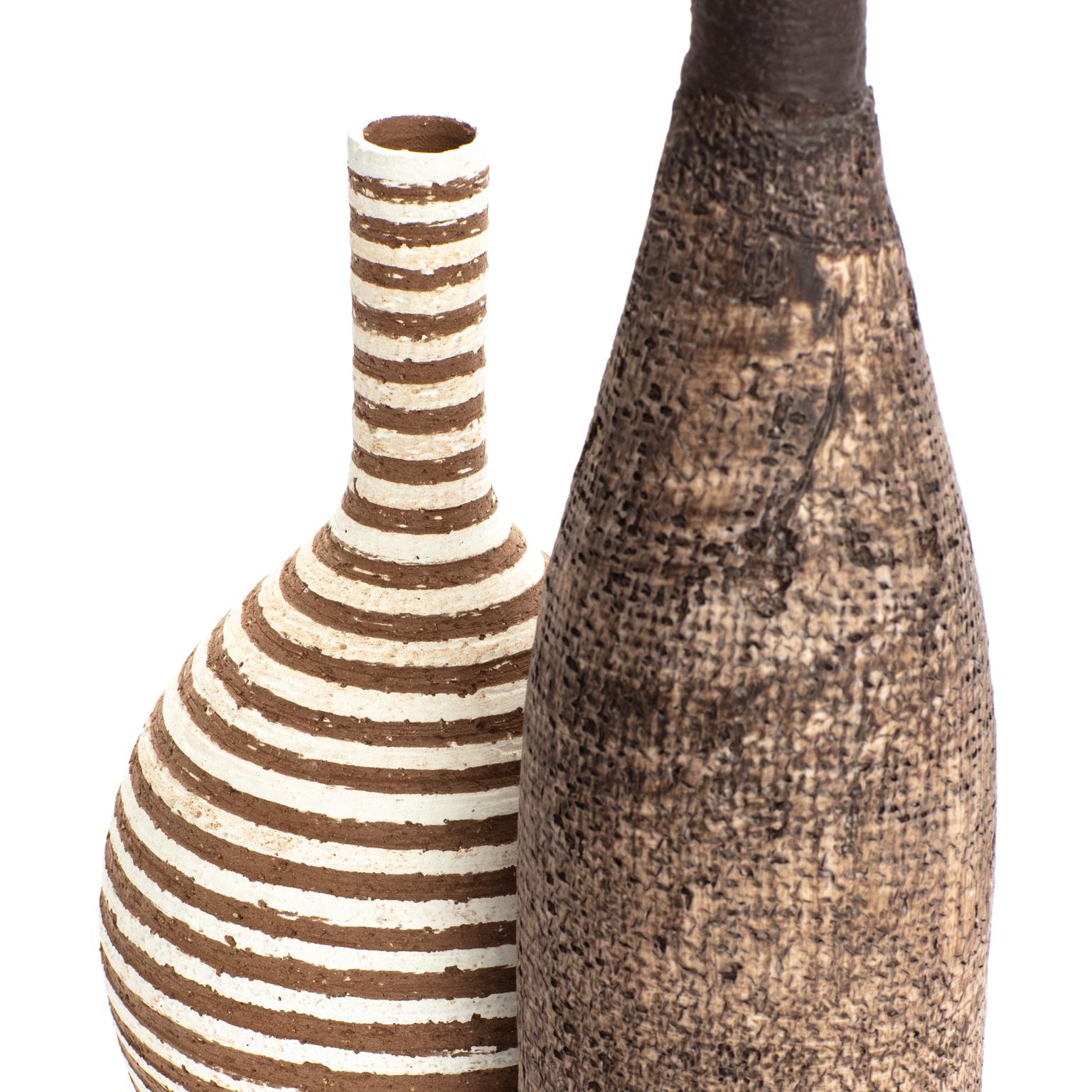 Measures: 

23 x 6 x 31 cm
34 x 4 x 23 cm

Egidio Milesi (Milano, 1955), after studying art at school approached the pottery and the ceramics in the late 1970s. Since 1980, in his studio in Milan, Egidio explored the clay world in every aspect.