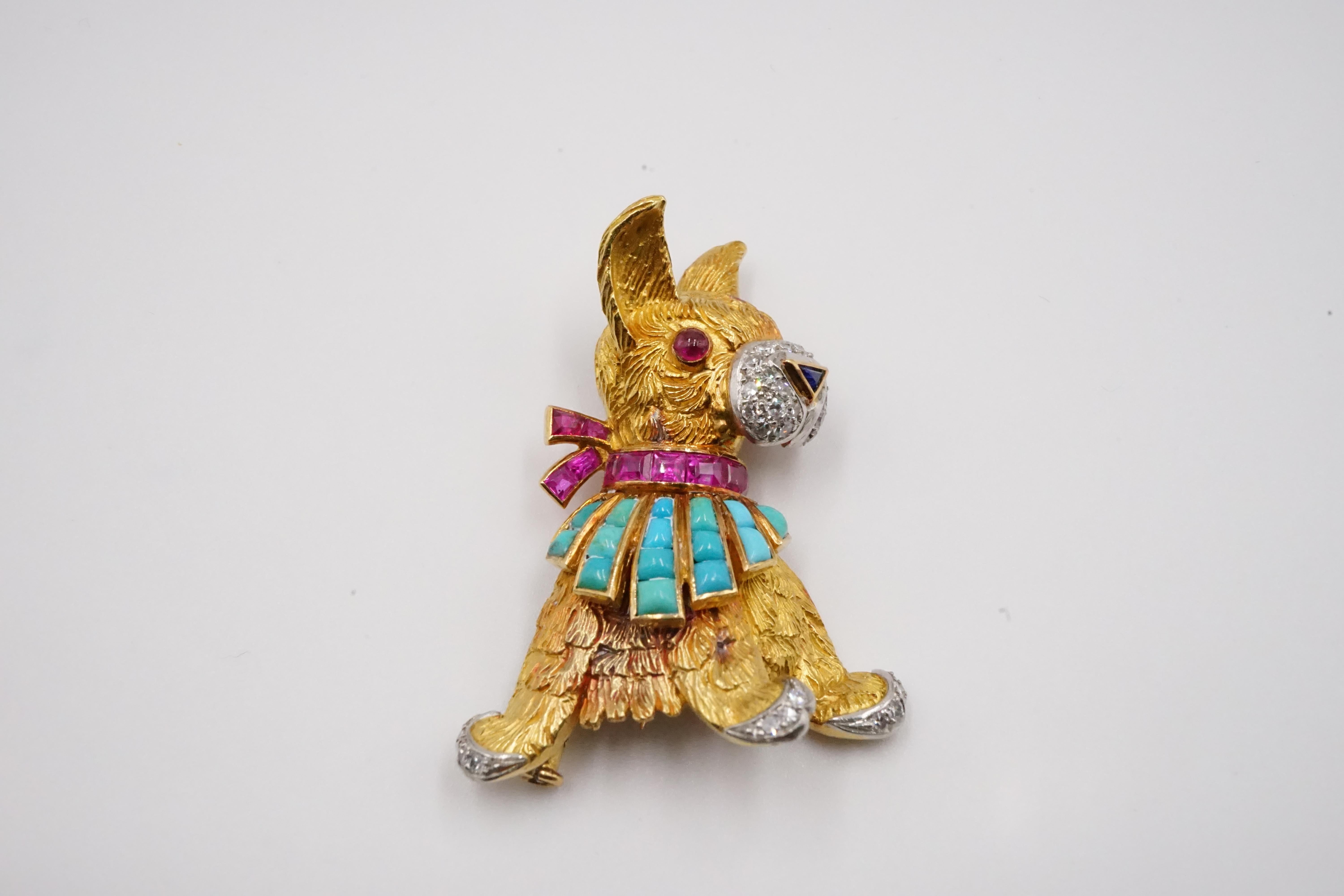 Two adorable 18K yellow gold Boucheron animal brooches - a hare and a puppy.

The hare measures W:2.8cm H: 4.9cm D: 1.0cm Weight:14.4g, sapphire eyes ruby nose and a turquoise collar. The hare stands with 2 feet and turned its head to the left  and