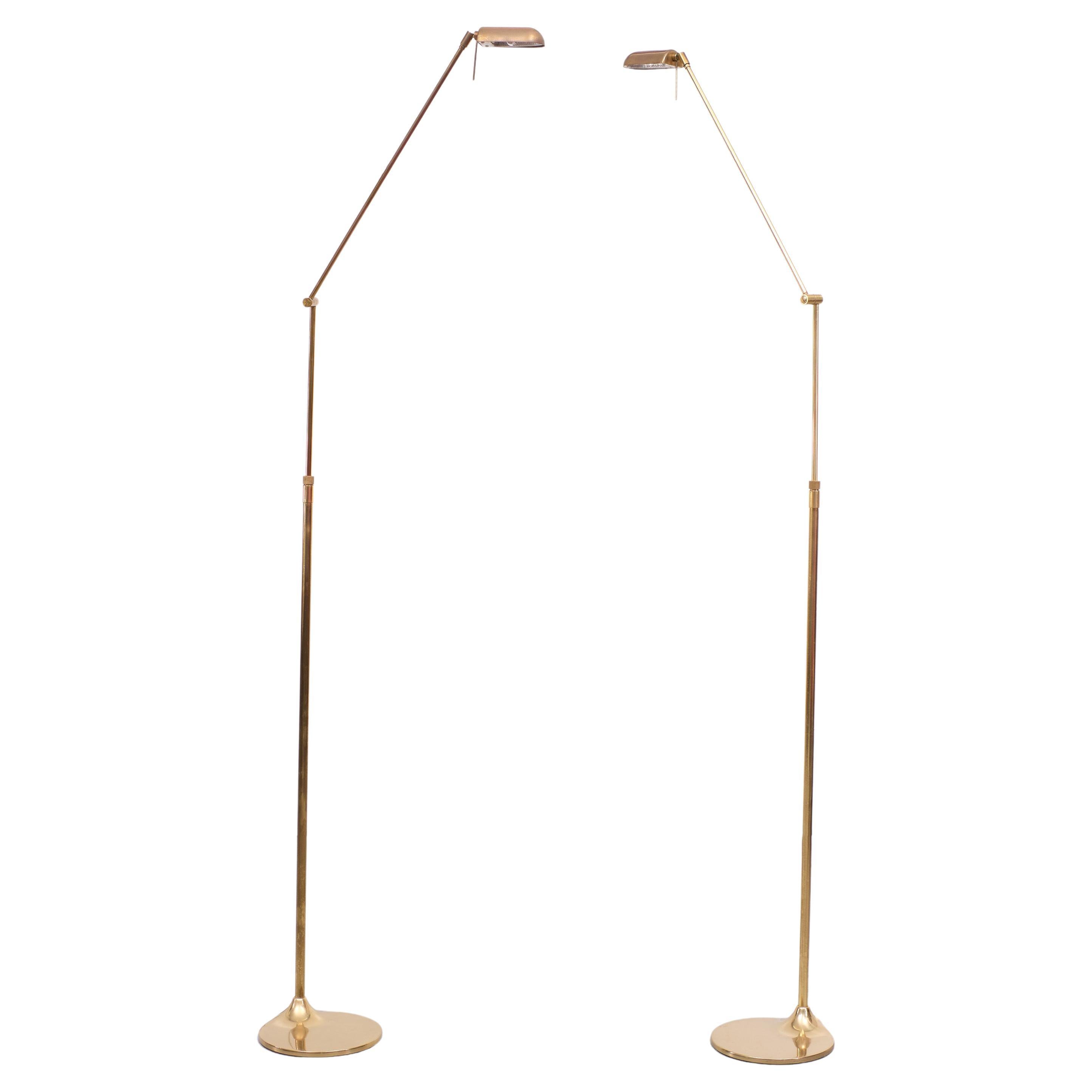 Two identical brass floor lamps. Very nice organic shaped feet. Adjustable in height Swing arm. Halogen comes with good working dimmers. Just the right amount of Patine. Perfect color. Good condition. Ben Demmers Dutch 
 Height 94 cm / 167 cm.