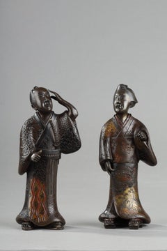 Two bronze figures of a Geisha and a Samurai