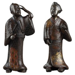 Two bronze figures of a Geisha and a Samurai