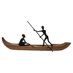 Two bronze sculptures in a wooden boat, by Hagenauer 1950s
