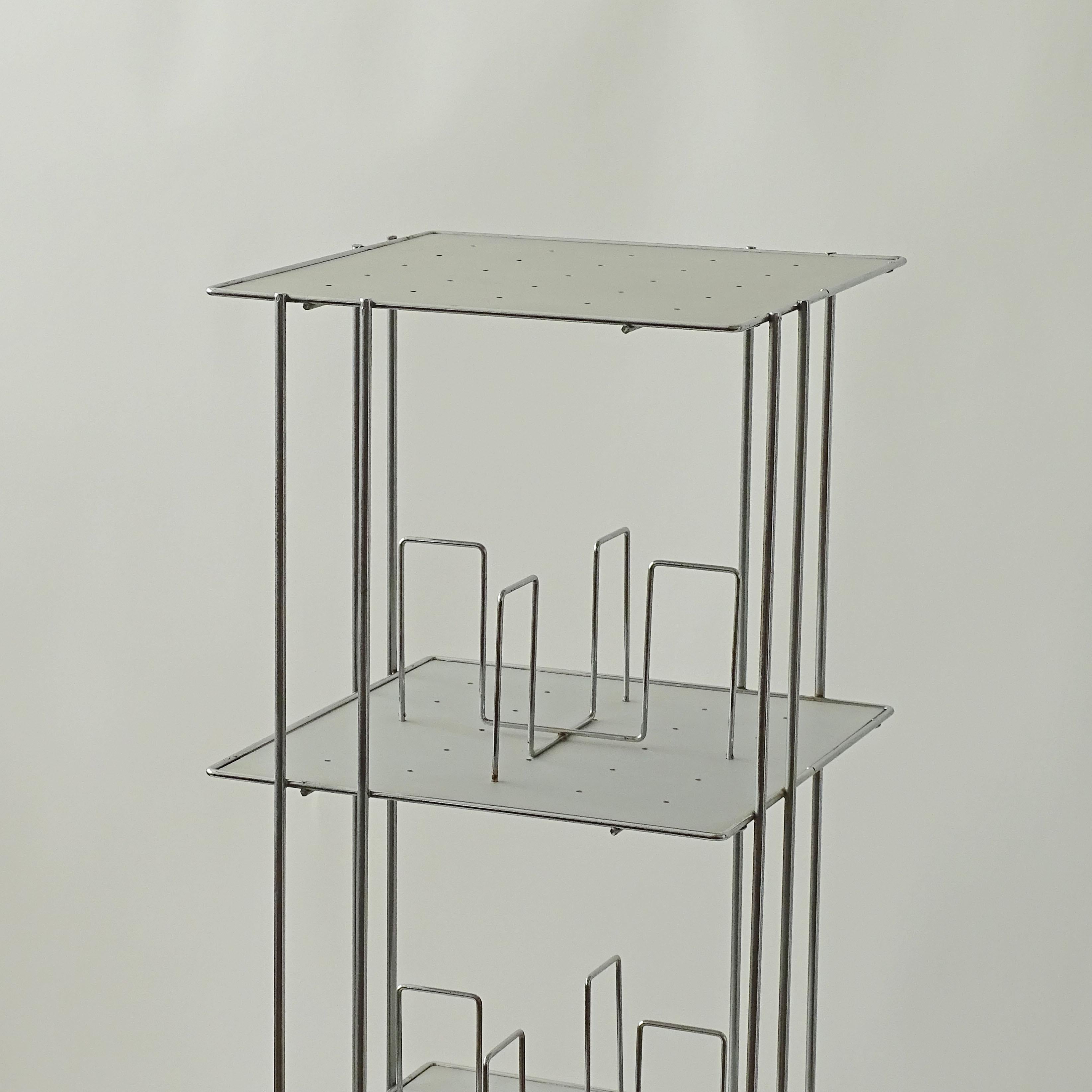 Bruno Munari two 'Vademecum' bookcase cart for Robots  1974 Chromed steel, aluminum. 
One measures 35.5 x 35.5 x H 128.5 cm.
Second measures 35.5 x 35.5 x H 68.3 cm.

