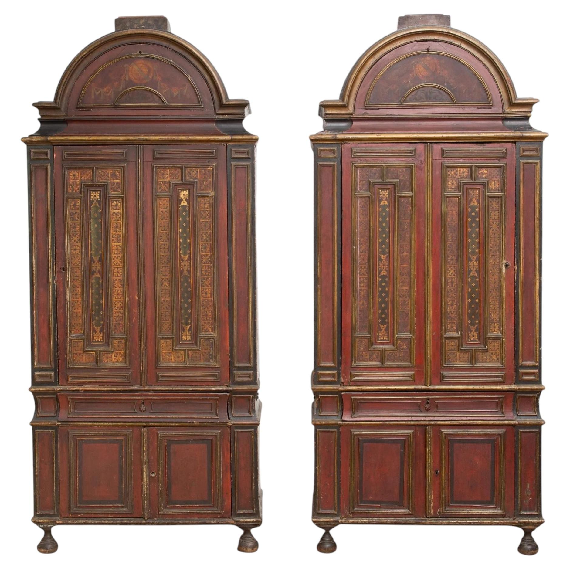 Two Cabinets in Blackened, Painted and Gilt Wood