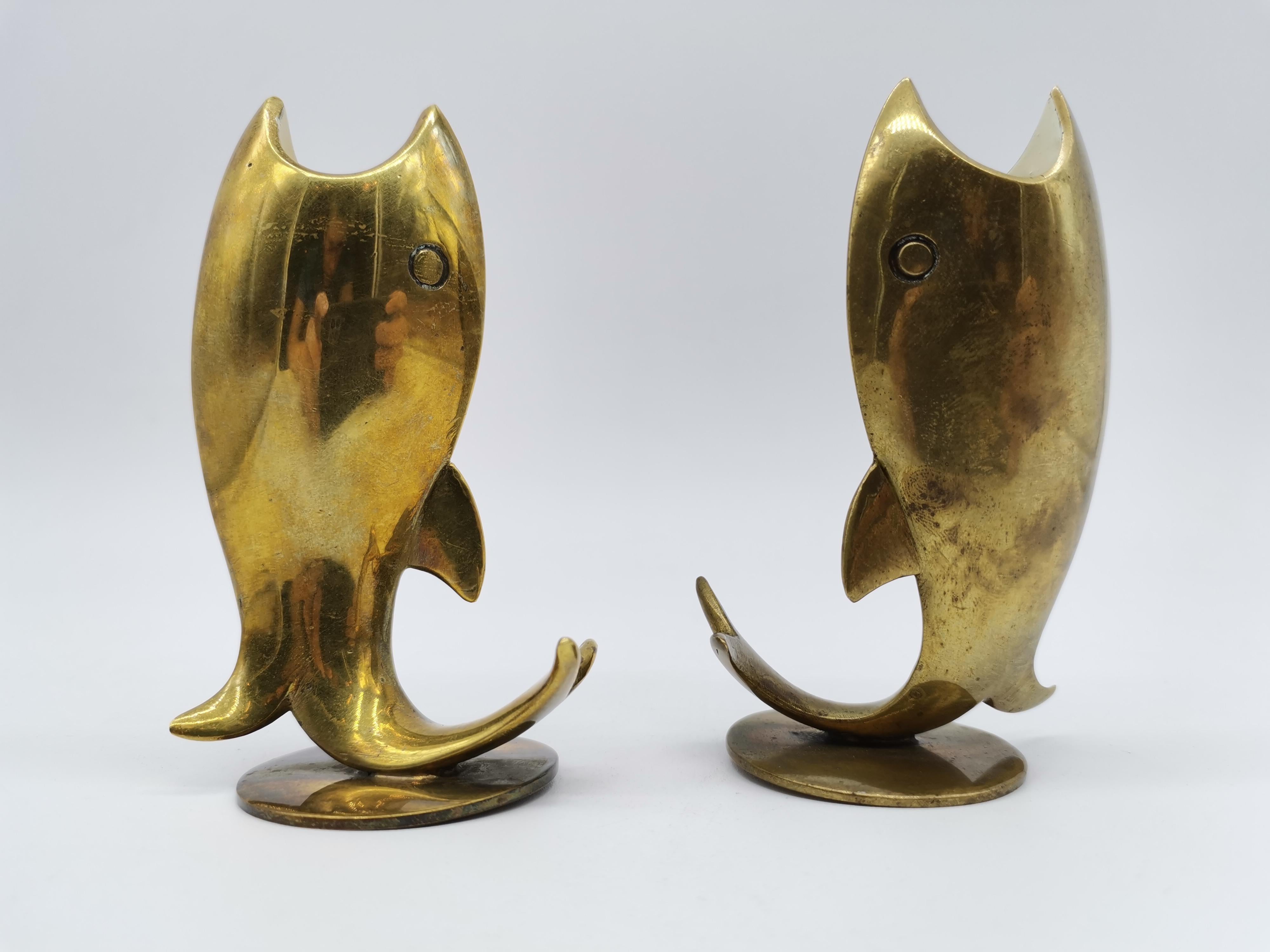 A pair of candle holders in fish look made out of brass and designed by Richard Rohac Vienna, Austria.