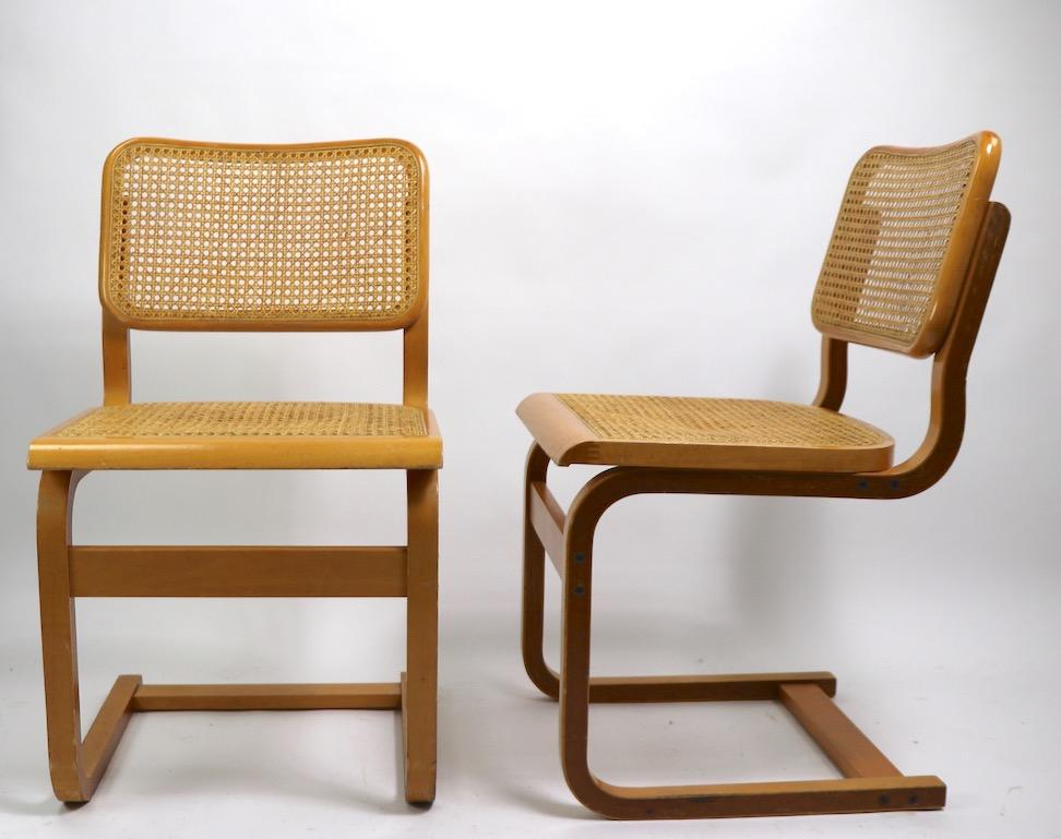 Two Cantilever Cane and Bentwood Dining Chairs after Alto and Breuer 1
