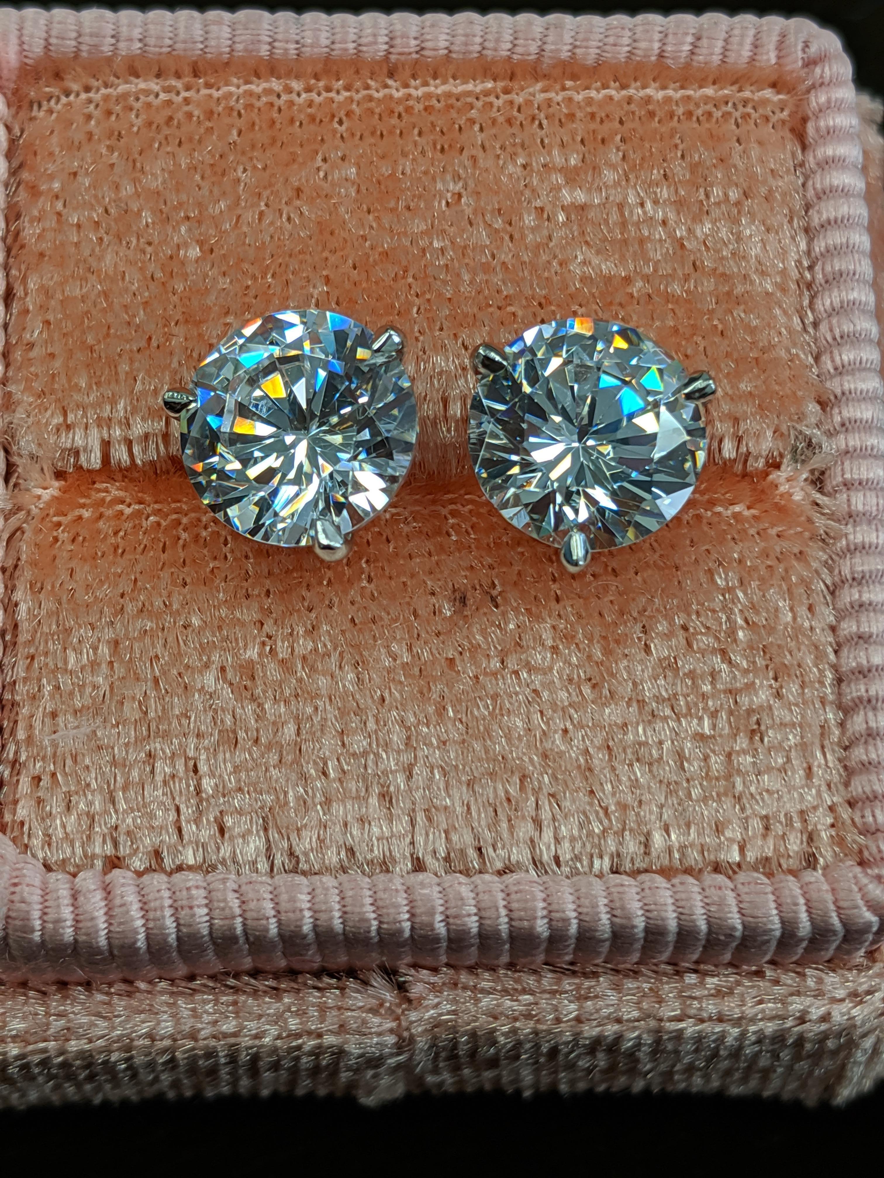 4 carat diamond earrings on ear