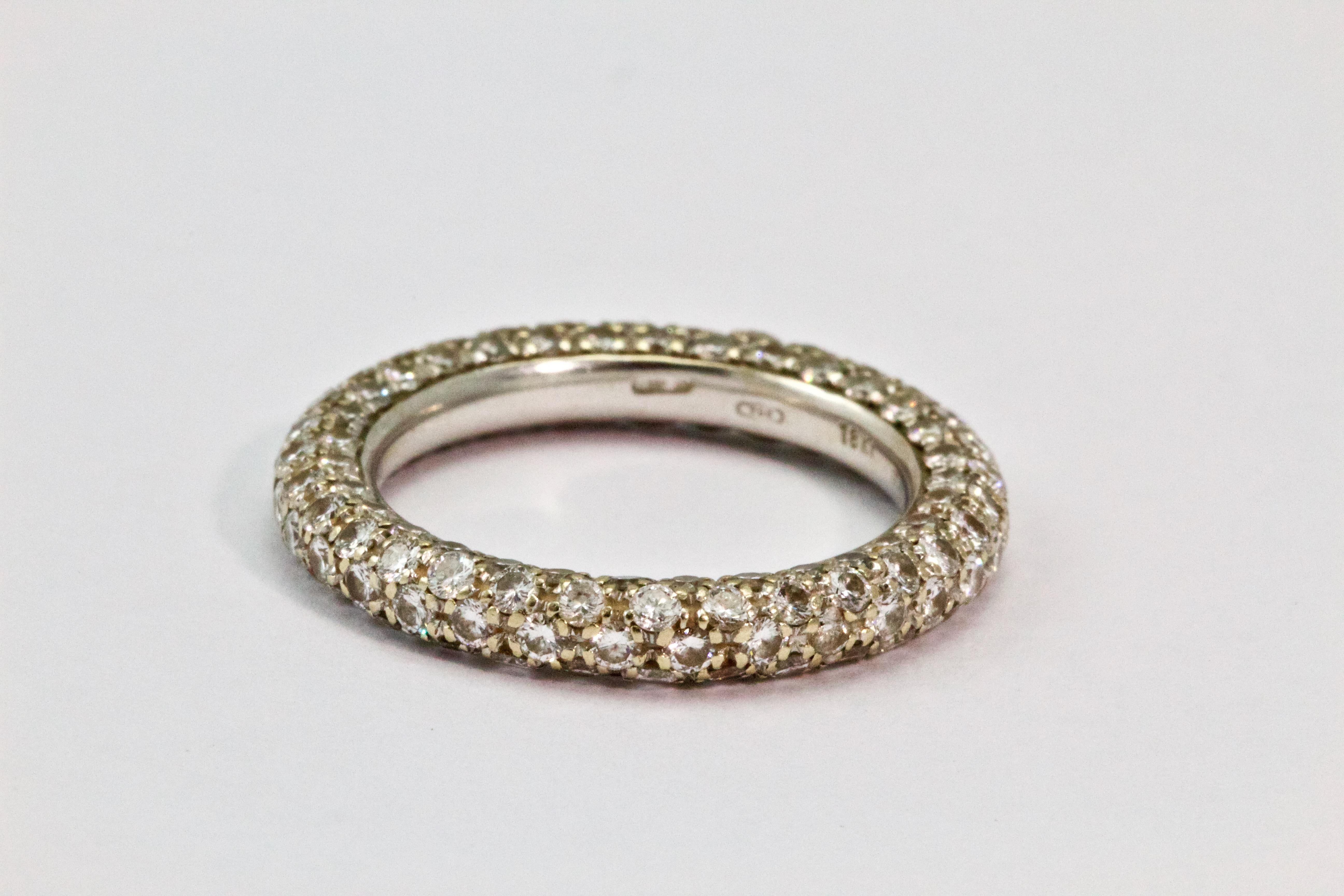 This beautiful diamond eternity band showcases five rows of round brilliant cut diamonds hand set in 18k white gold. The diamonds total 2 carats in weight ( H - VS2) .
Ring Size : 5 3/4 or L 
Weight : 4.7 Grams 