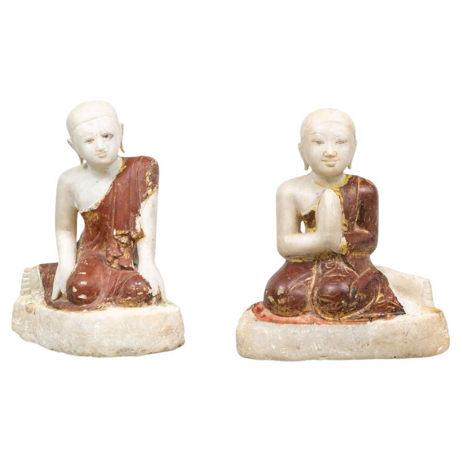 Two Carved and Painted Marble Buddhist Figures