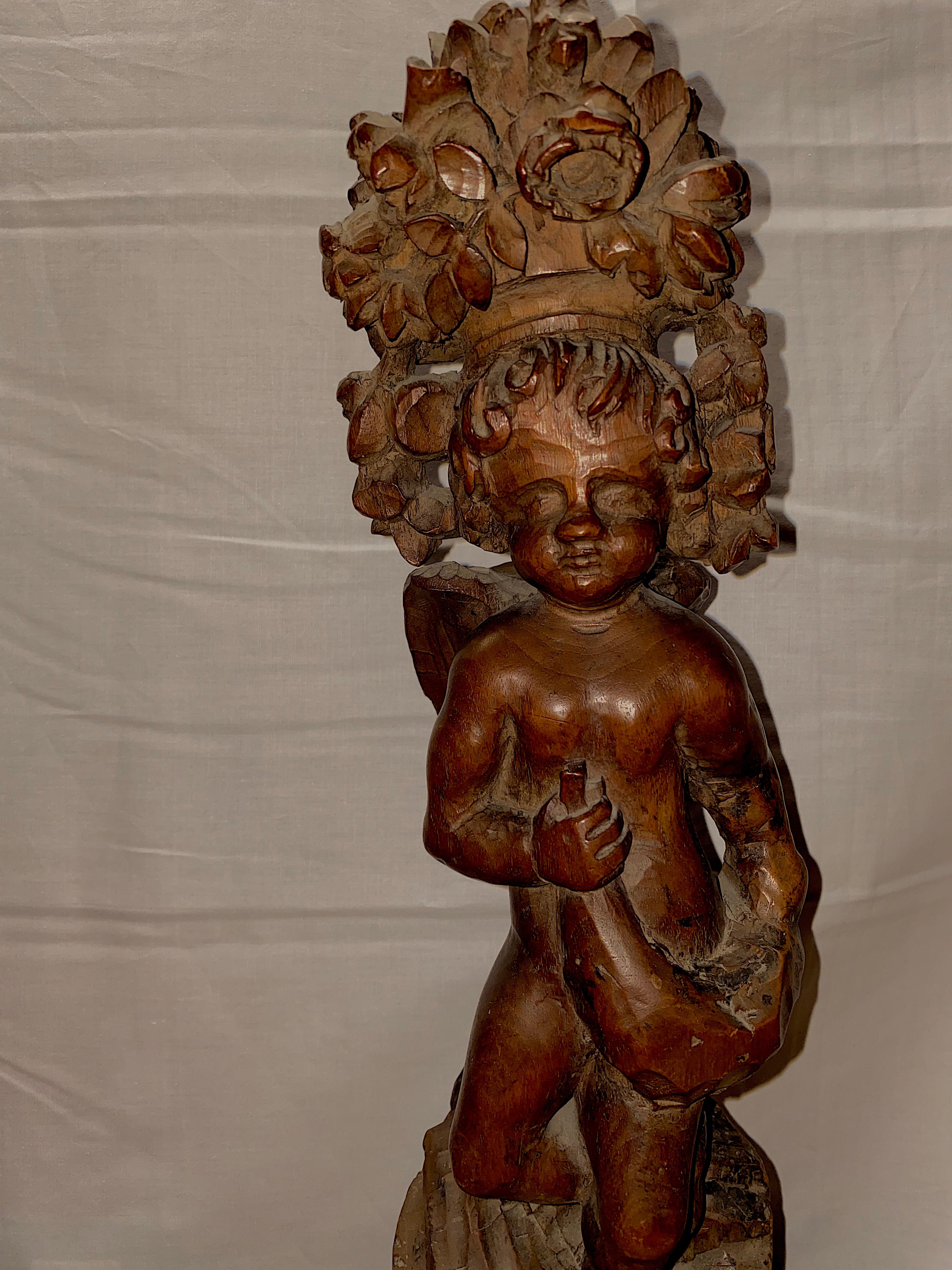 European Two Carved Wood 18th Century Baroque Cupids, with Crown of Foliage For Sale