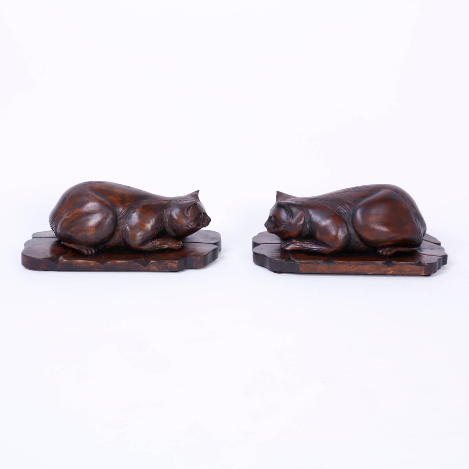 Antique English country cats poised in the familiar pounce posture on a faux stone base. Expertly carved out of pine and presented with a folky rustic finish.