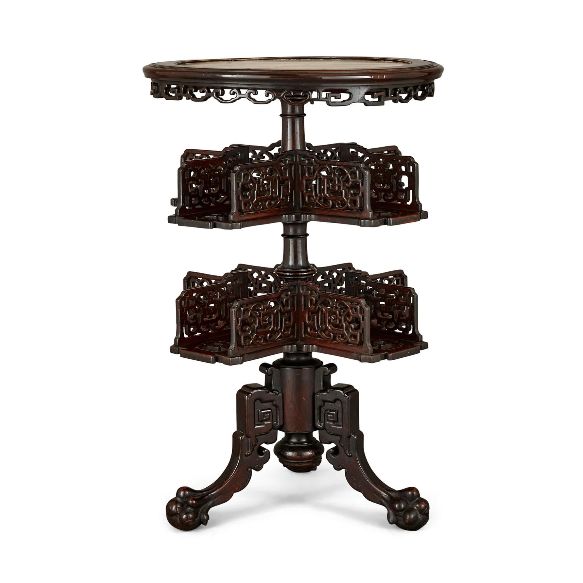 Two carved wood, marble and onyx Chinese tables
Chinese, Early 20th Century 
Height 77cm, diameter 51cm

Intricately carved and elegantly formed, the two Chinese tables feature round tabletops inlaid with brightly coloured marble and