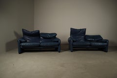Two Cassina Maralunga two-seat sofas in blue leather by Vico Magistretti, Italy