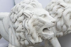 Two Cast Cement or Concrete Walking Lions