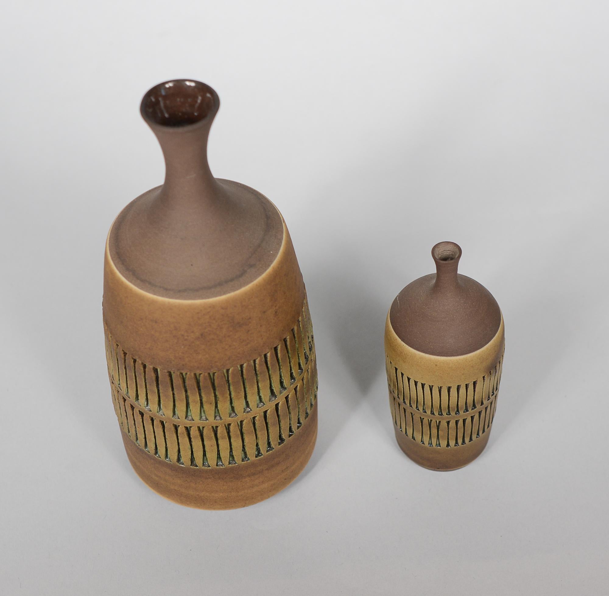 Two incised ceramic vases by Swedish artist Tomas Anagrius. These were made at his studio in Alingsas, Sweden in the 1960's.