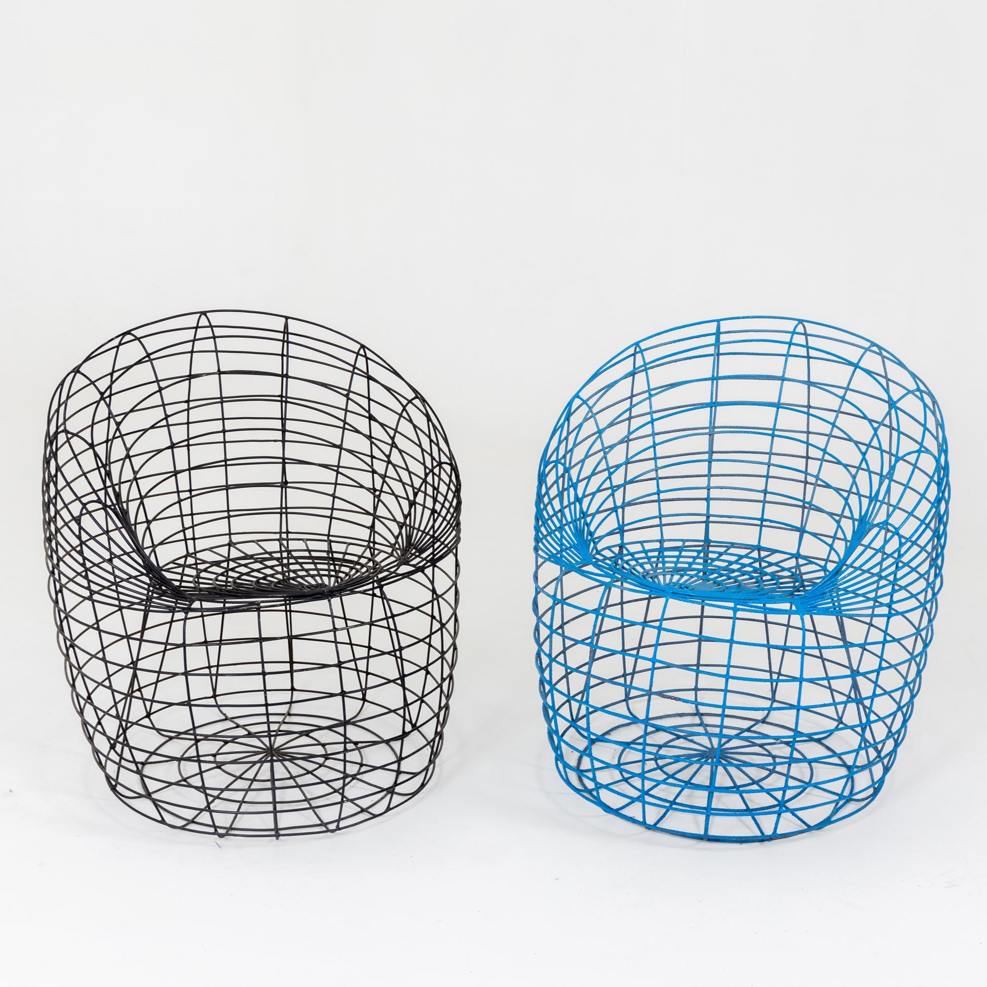 Two chairs made of single welded metal bars painted in blue and black respectively. The monogram AS is integrated on the edge of the seat. As a designer, Anacleto Spazzapan (born 1943) sees himself in the service of modernity. However, antiques