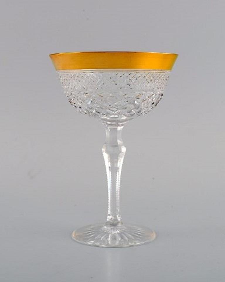 Two champagne glasses in mouth-blown crystal glass with gold edge, France, 1930s.
Measures: 14.5 x 10 cm.
In excellent condition.