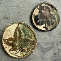 Two champlevé enamelled bronze roundels. English, 13th/14th century.