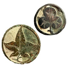 Two champlevé enamelled bronze roundels. English, 13th/14th century.