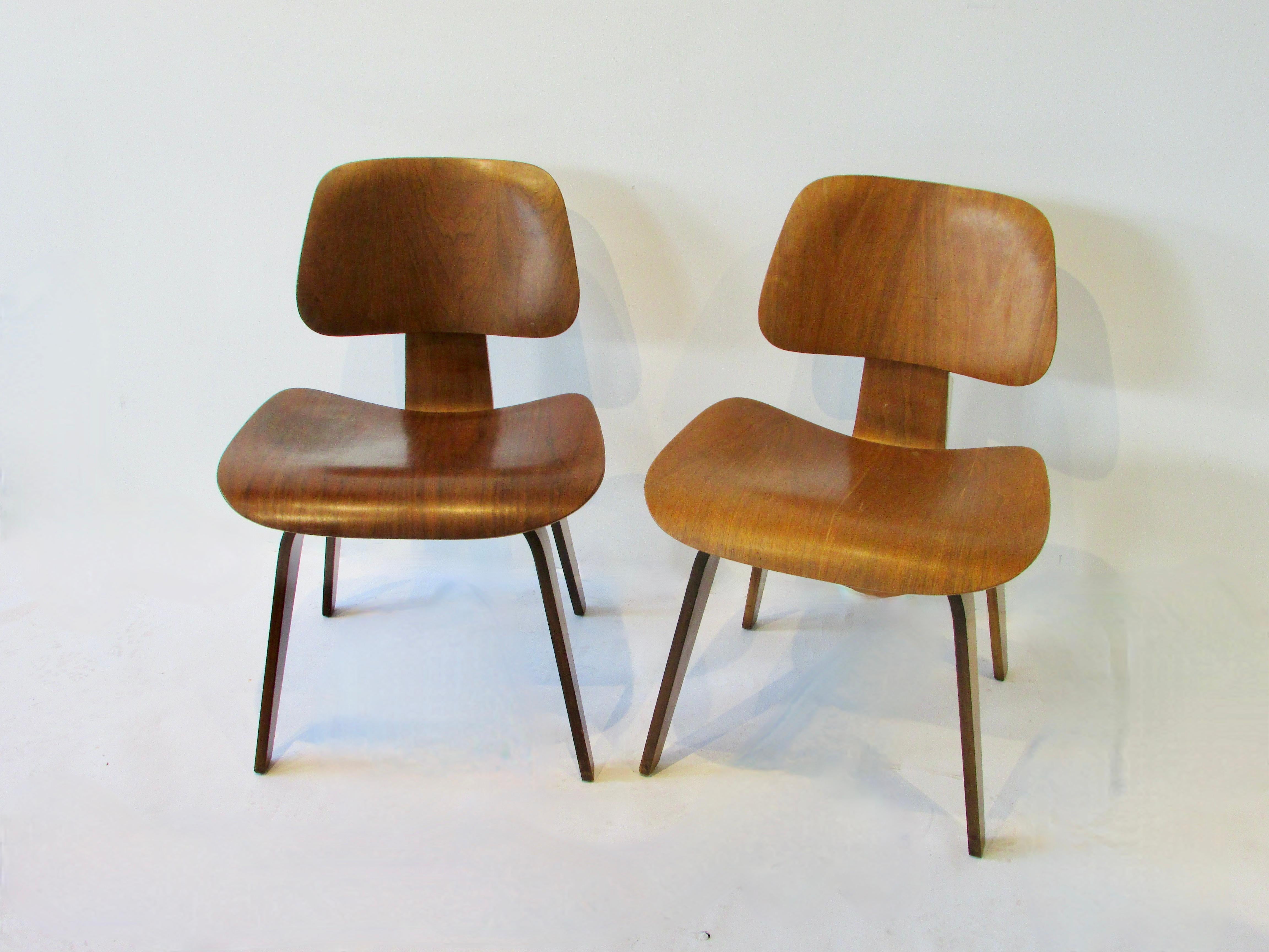 Hand-Crafted Two Charles and Ray Eames Herman Miller DCW chairs For Sale