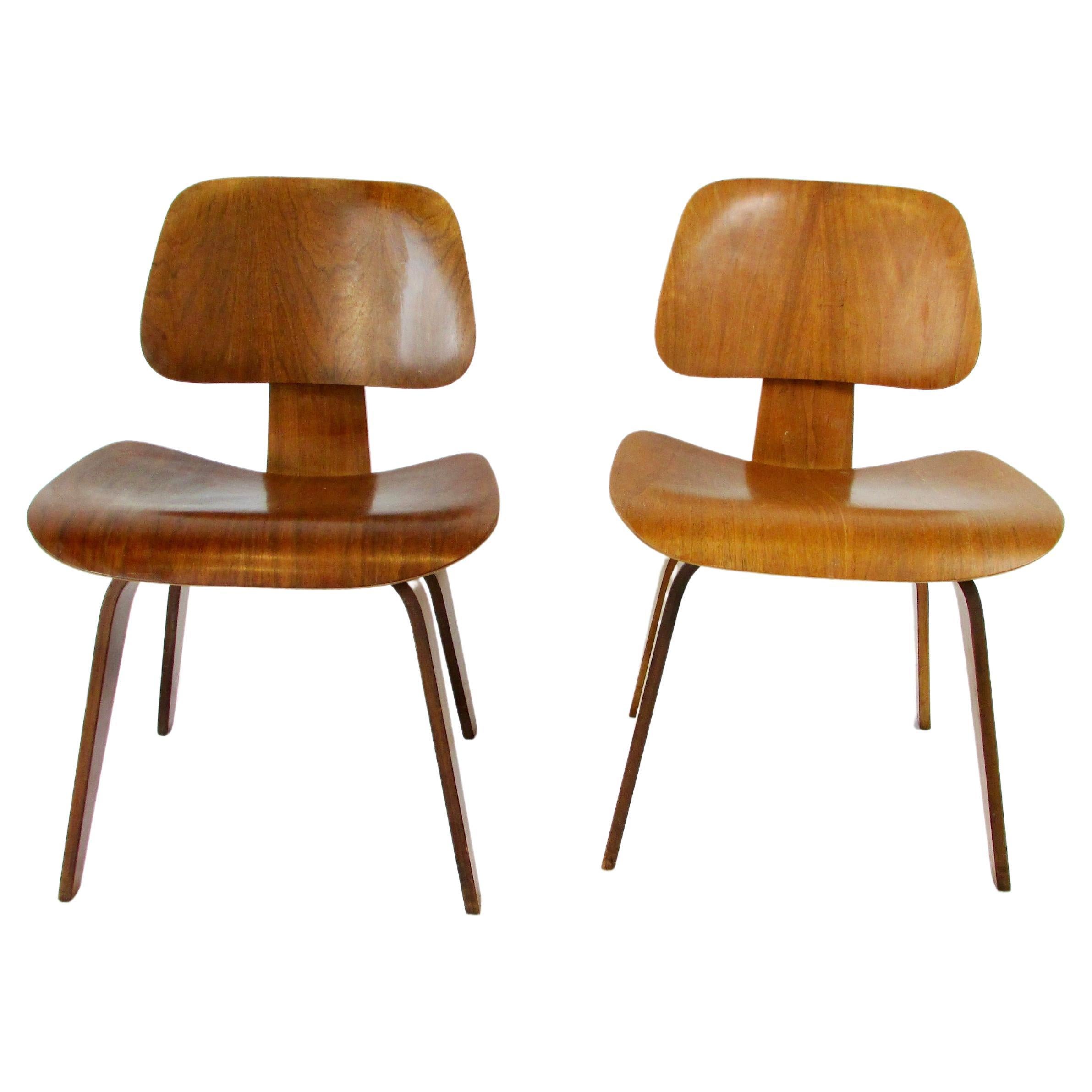 Two Charles and Ray Eames Herman Miller DCW chairs For Sale